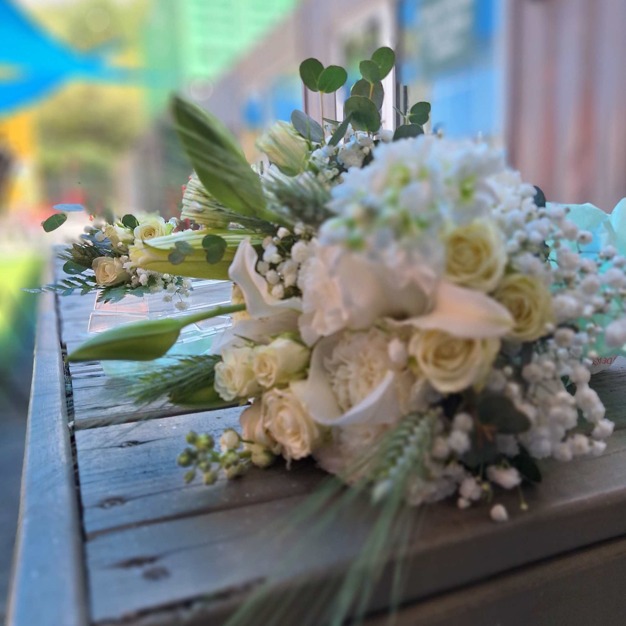 An all-white wedding set with boutonniere and wrapped Bridal bouquet. Lissen', we An all-white wedding set with boutonniere and wrapped Bridal bouquet. Lissen', we