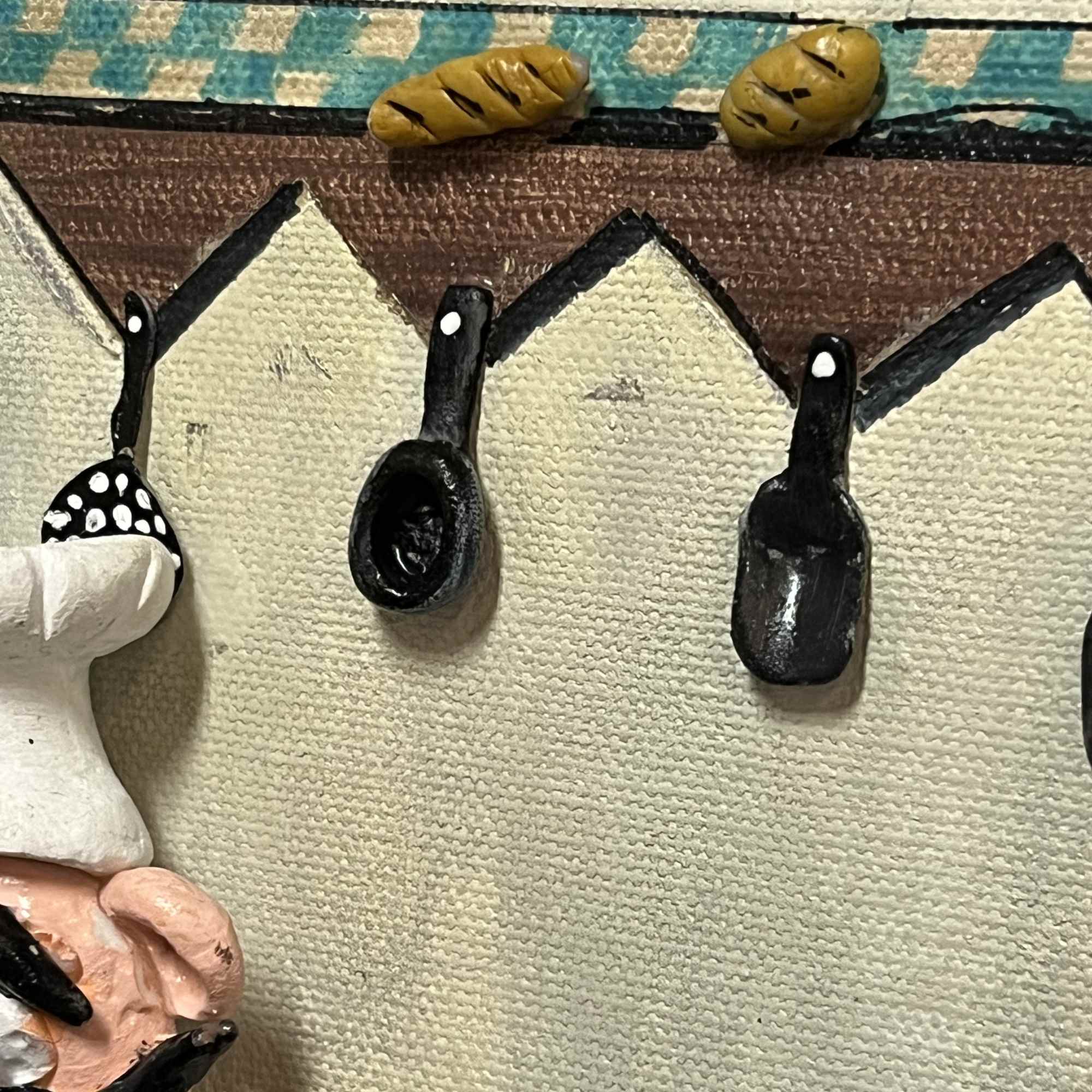 A completely hand made, molded clay, painted on a 9.5&rdquo;x11.5&rdquo; wooden frame.