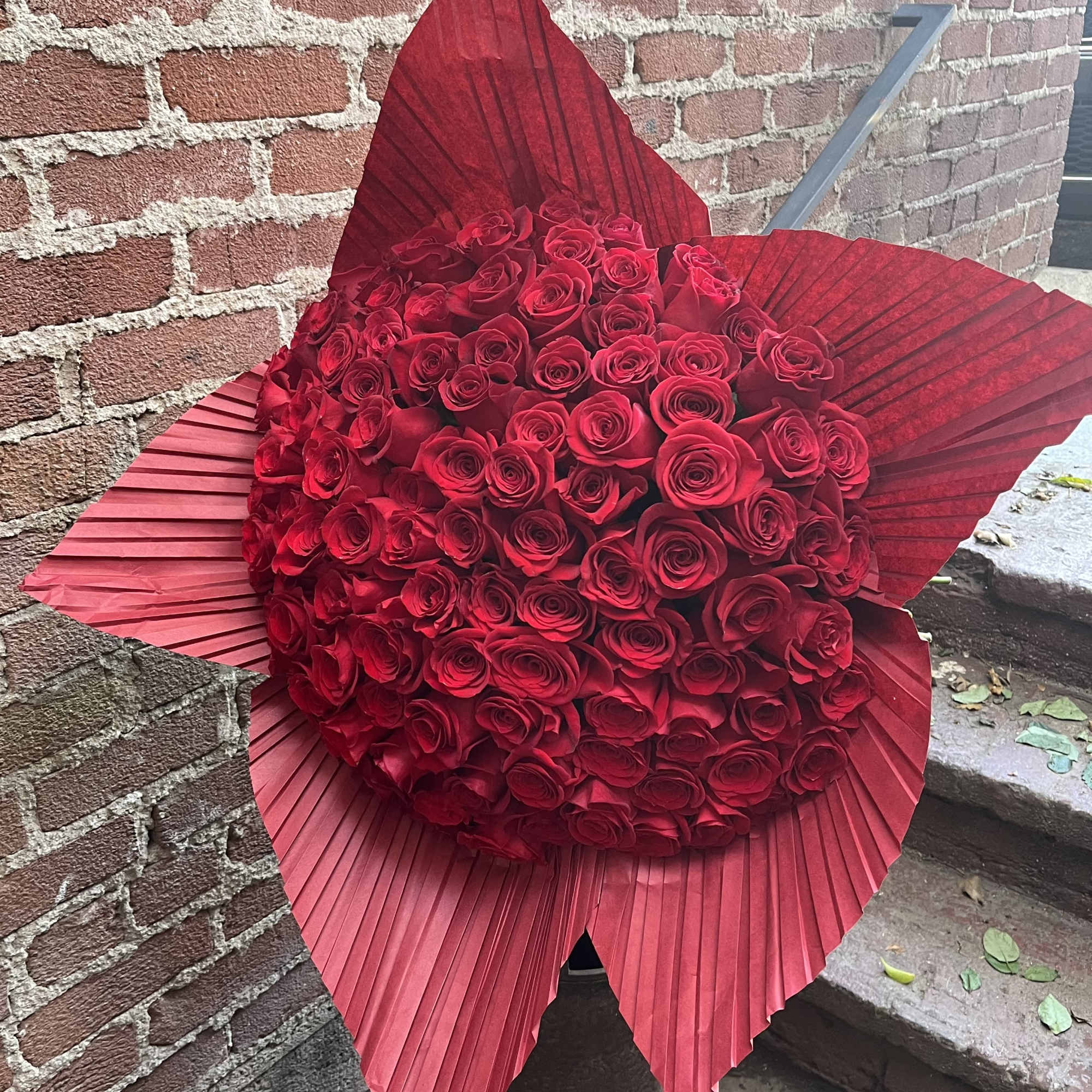 Introducing our breathtaking bouquet of 50 Red Roses, a timeless expression of