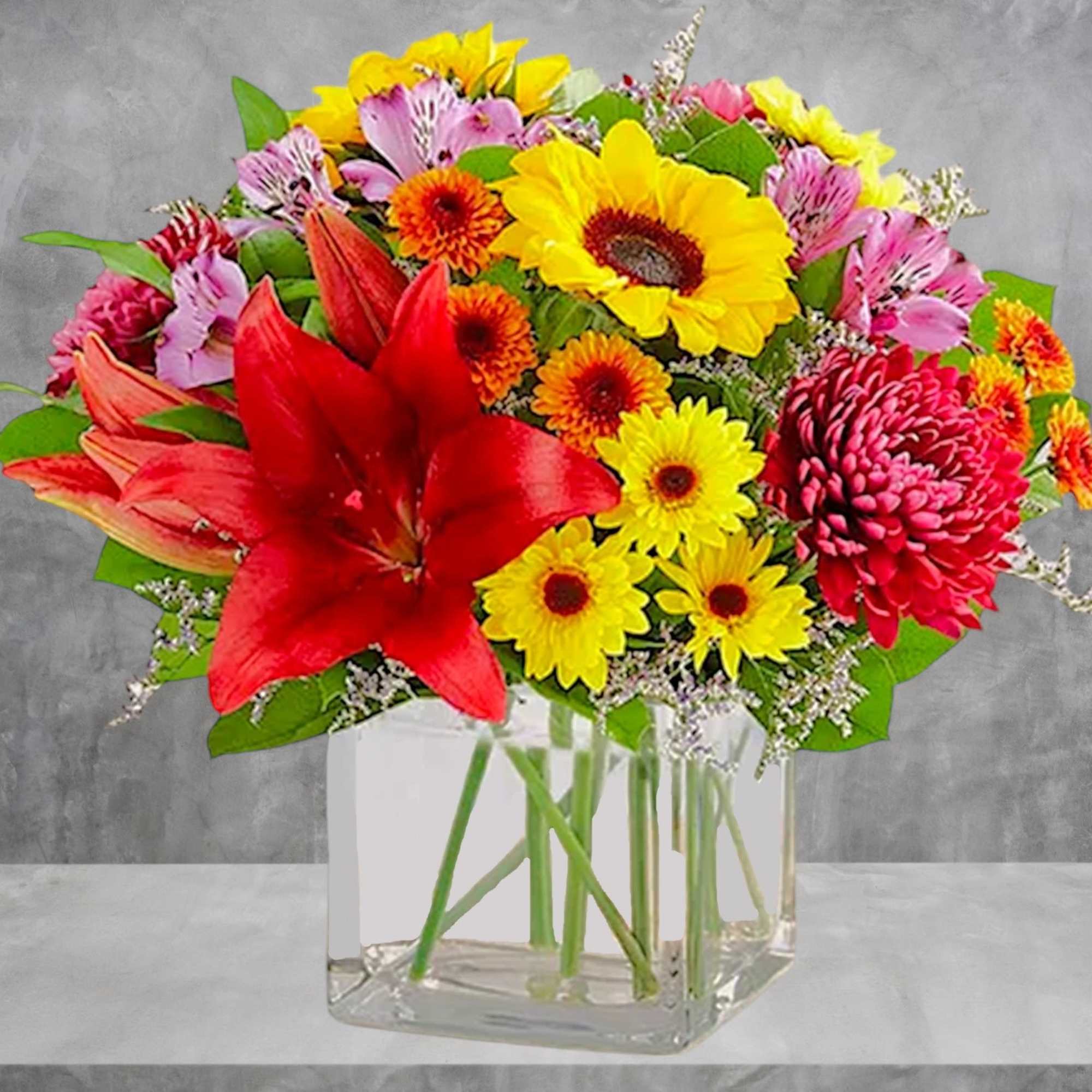 Embrace autumn&rsquo;s allure with our harvest-inspired arrangement. A loose gathering of blooms