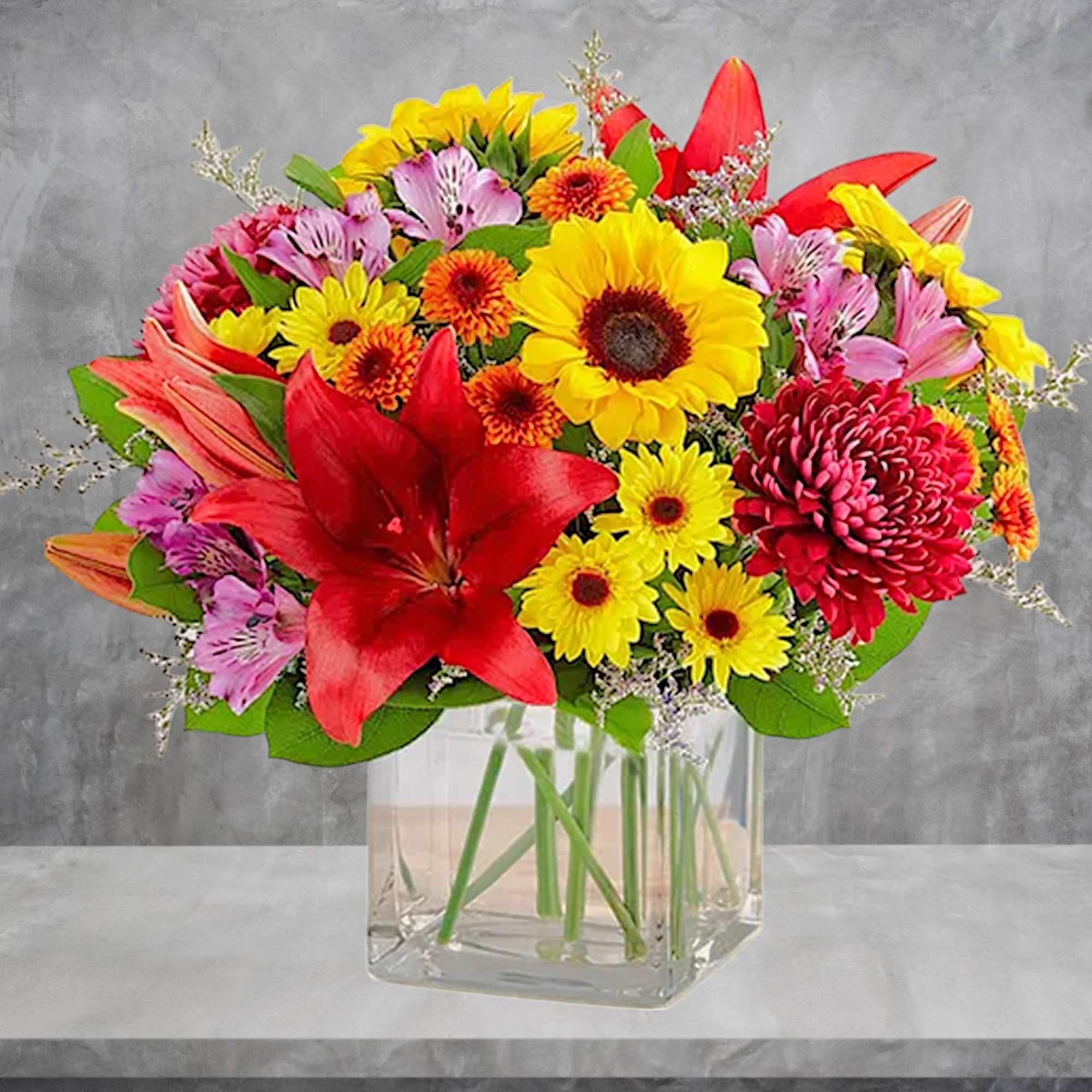 Embrace autumn&rsquo;s allure with our harvest-inspired arrangement. A loose gathering of blooms
