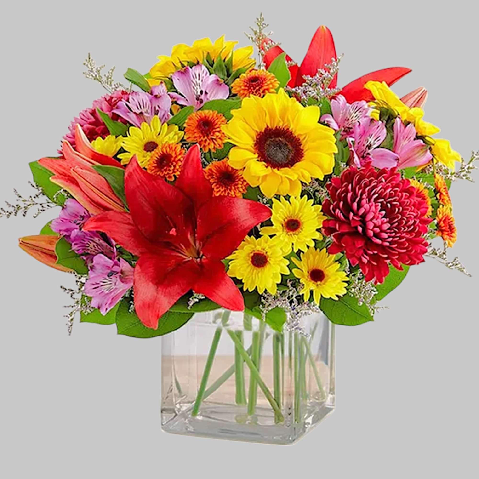 Embrace autumn&rsquo;s allure with our harvest-inspired arrangement. A loose gathering of blooms