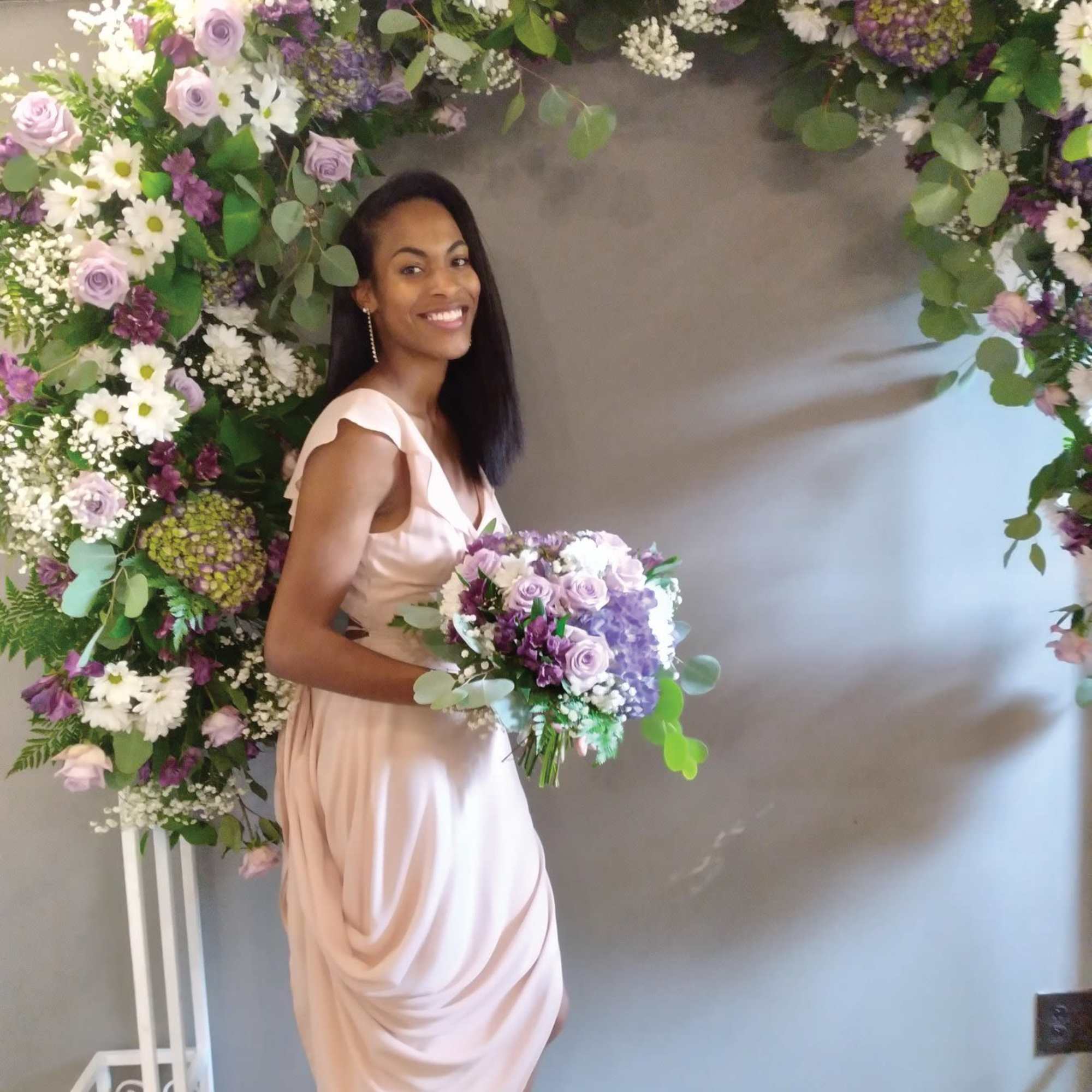 Beautiful shades of purple "cool water" roses, hydrangea and daisies round bridal