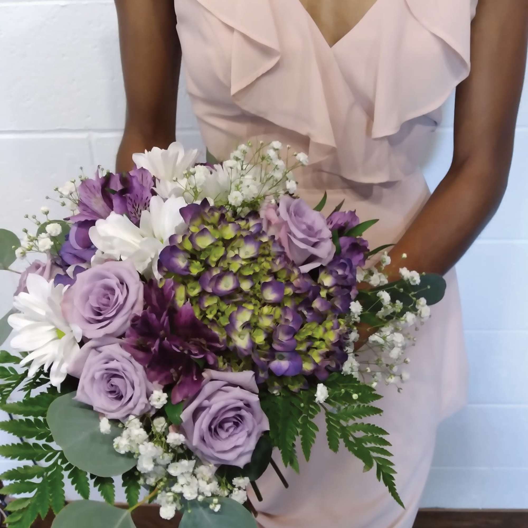 Beautiful shades of purple "cool water" roses, hydrangea and daisies round bridal