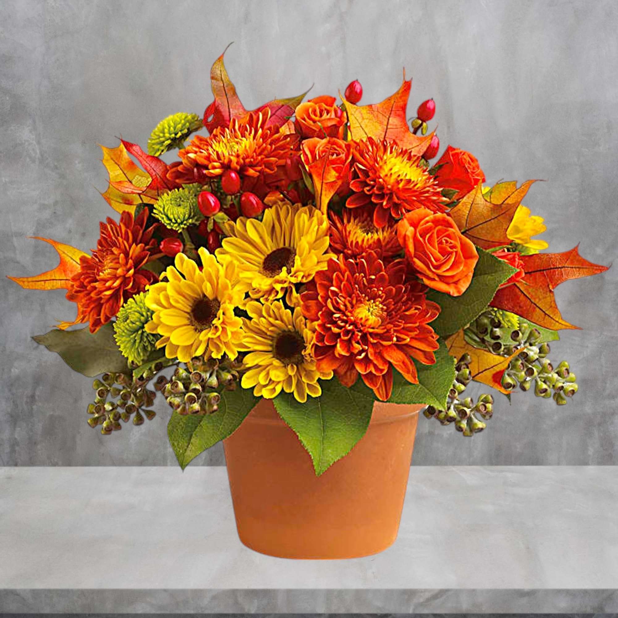 Autumnal colors are nestled together with brilliant fall leaves to create a