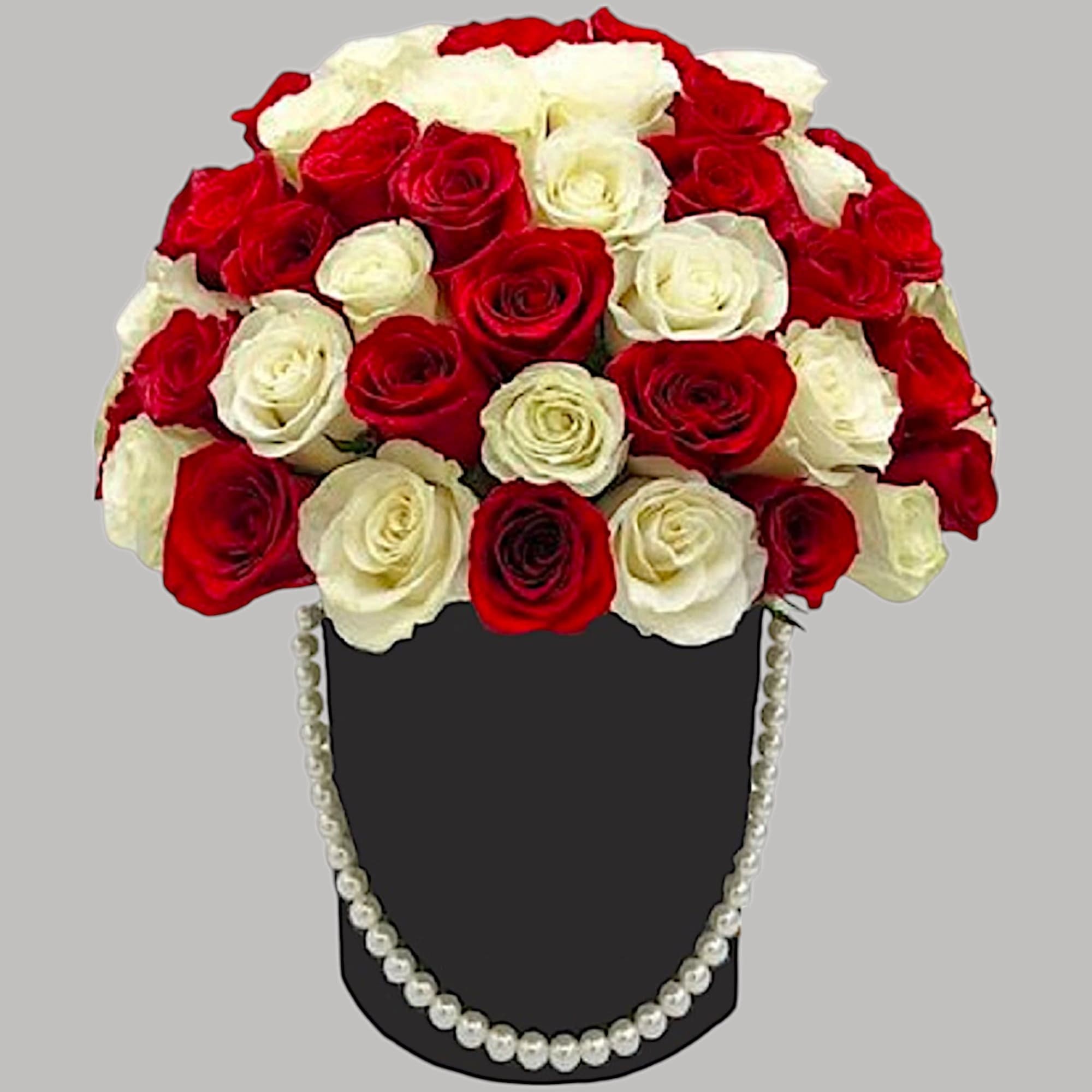 A modern flower arrangement in a heart box filled with roses.

DETAILS
This cylinder