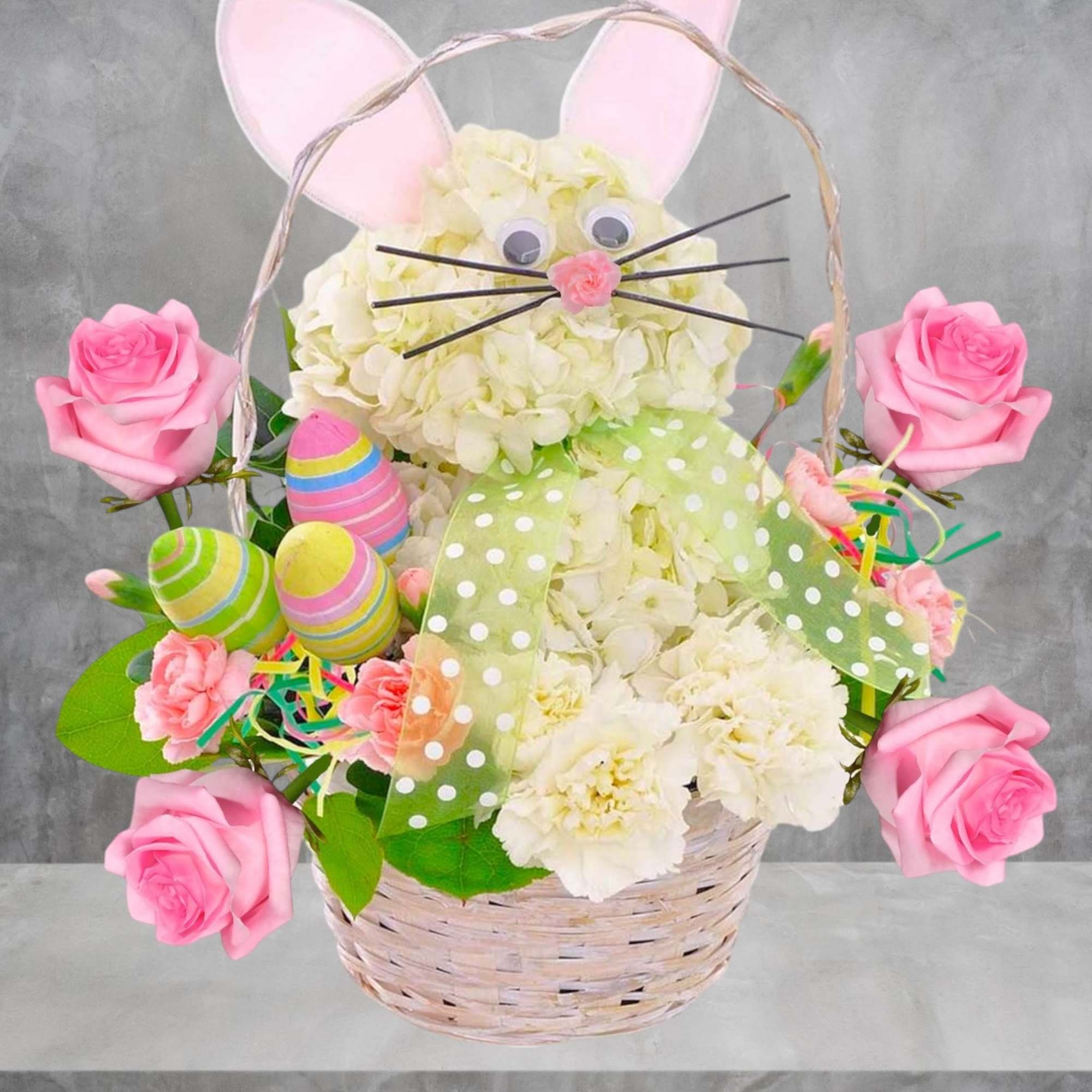 This Easter Bunny arrangement with colorful decorative eggs. Easter Bunny is wearing