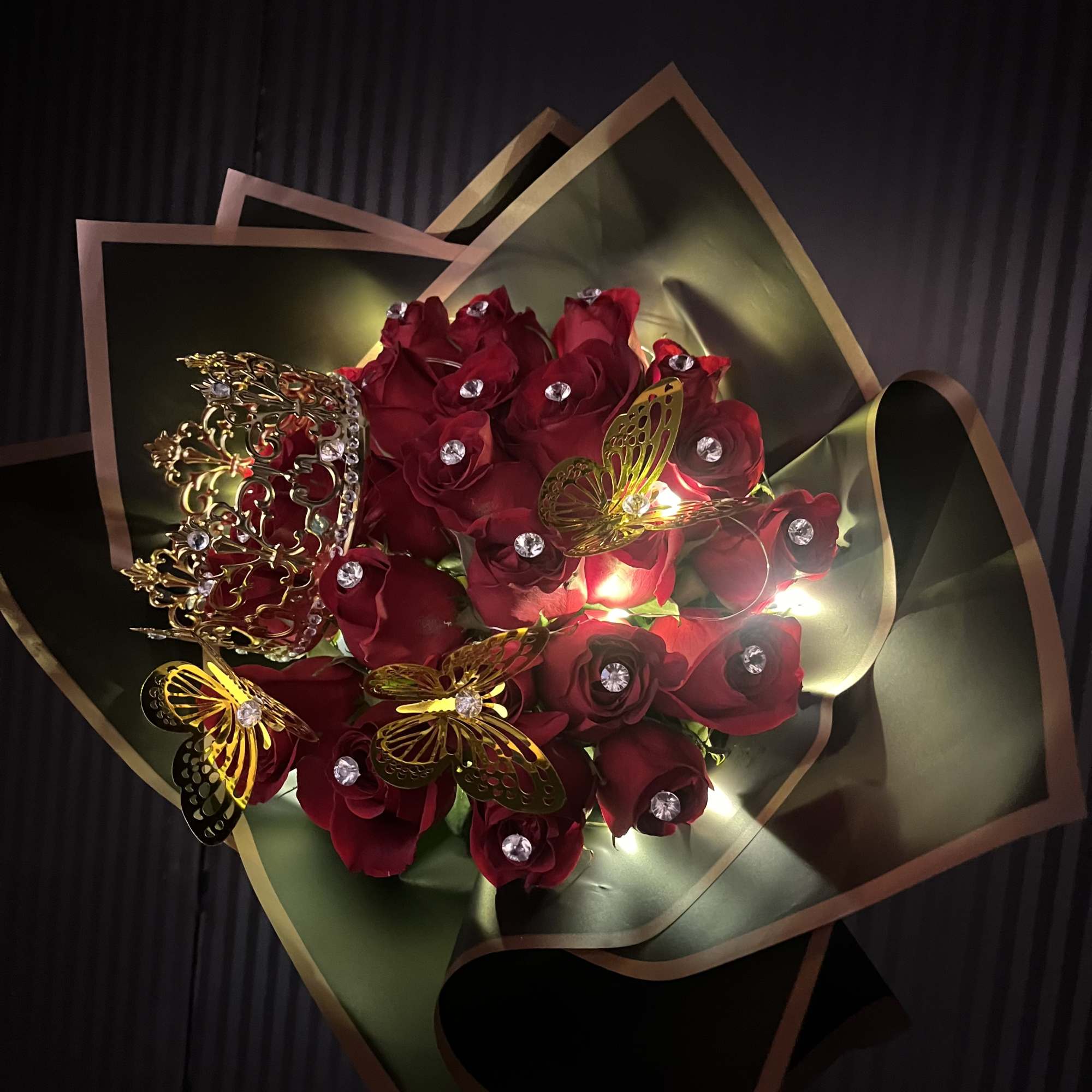 25 long stemmed roses, with a gem pin in each rose, led