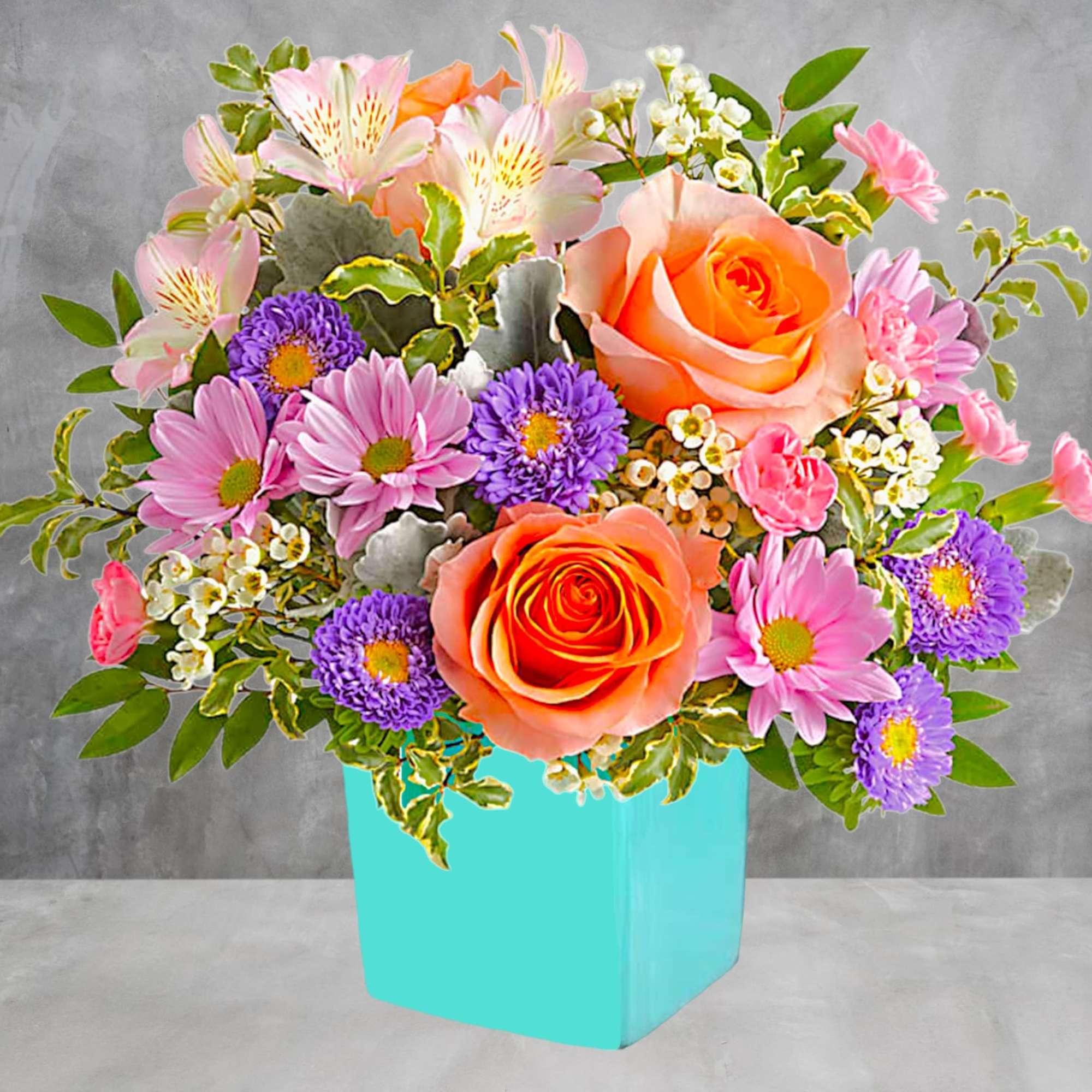 This floral arrangement features the sweetest shades of spring in one whimsical
