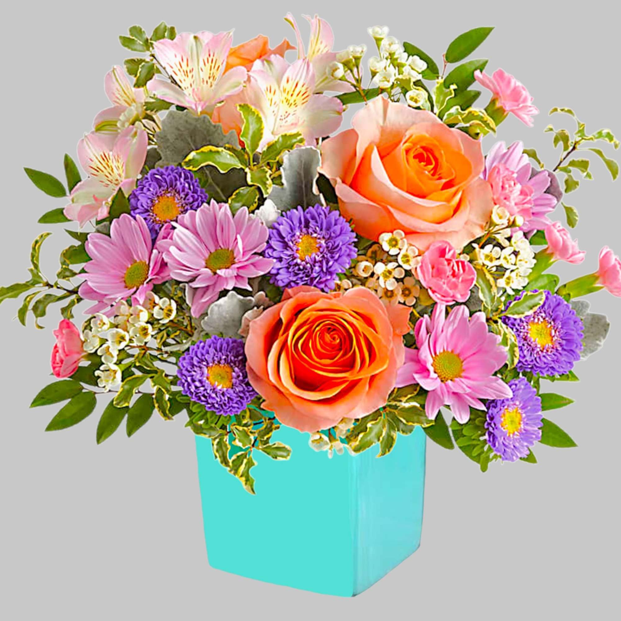 This floral arrangement features the sweetest shades of spring in one whimsical