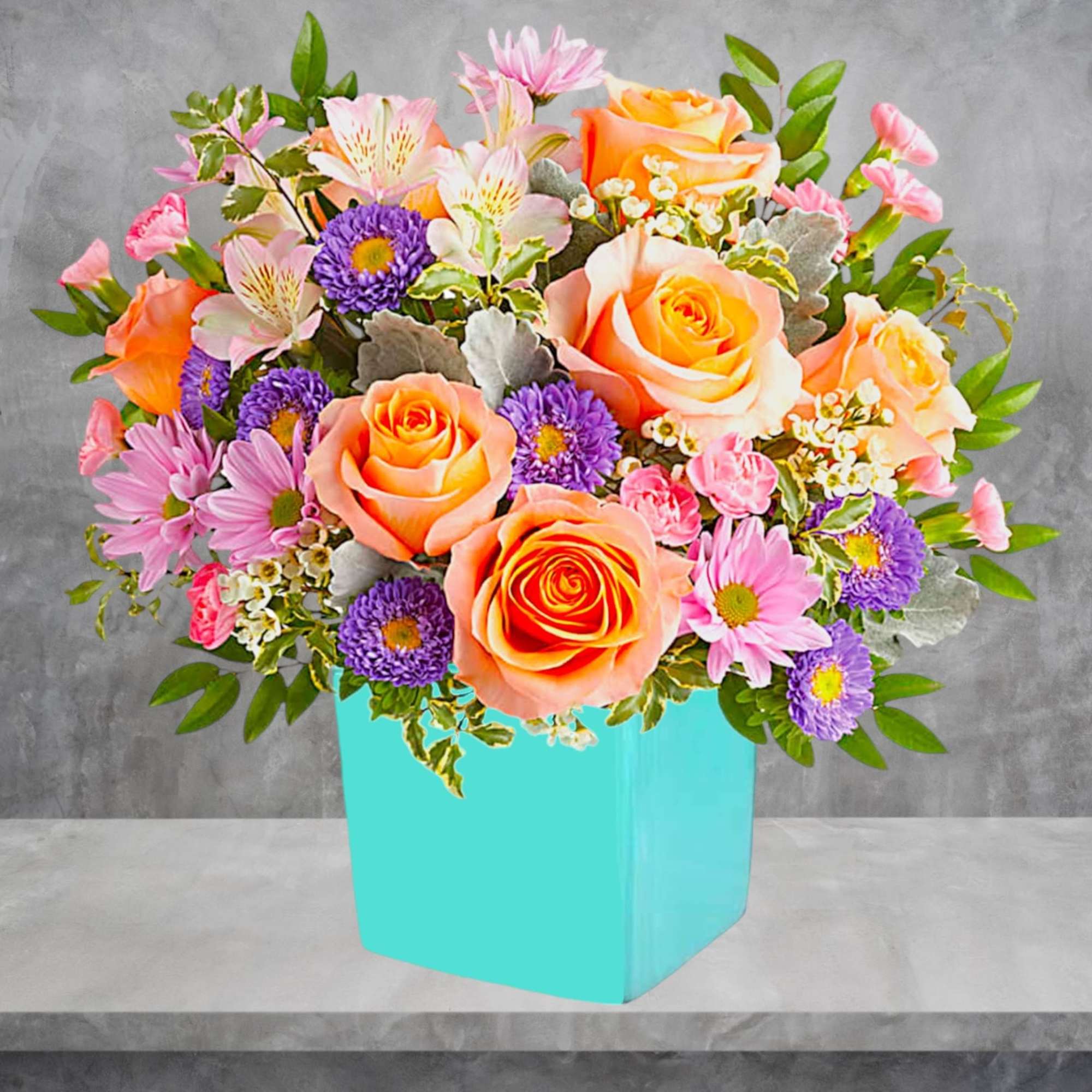 This floral arrangement features the sweetest shades of spring in one whimsical