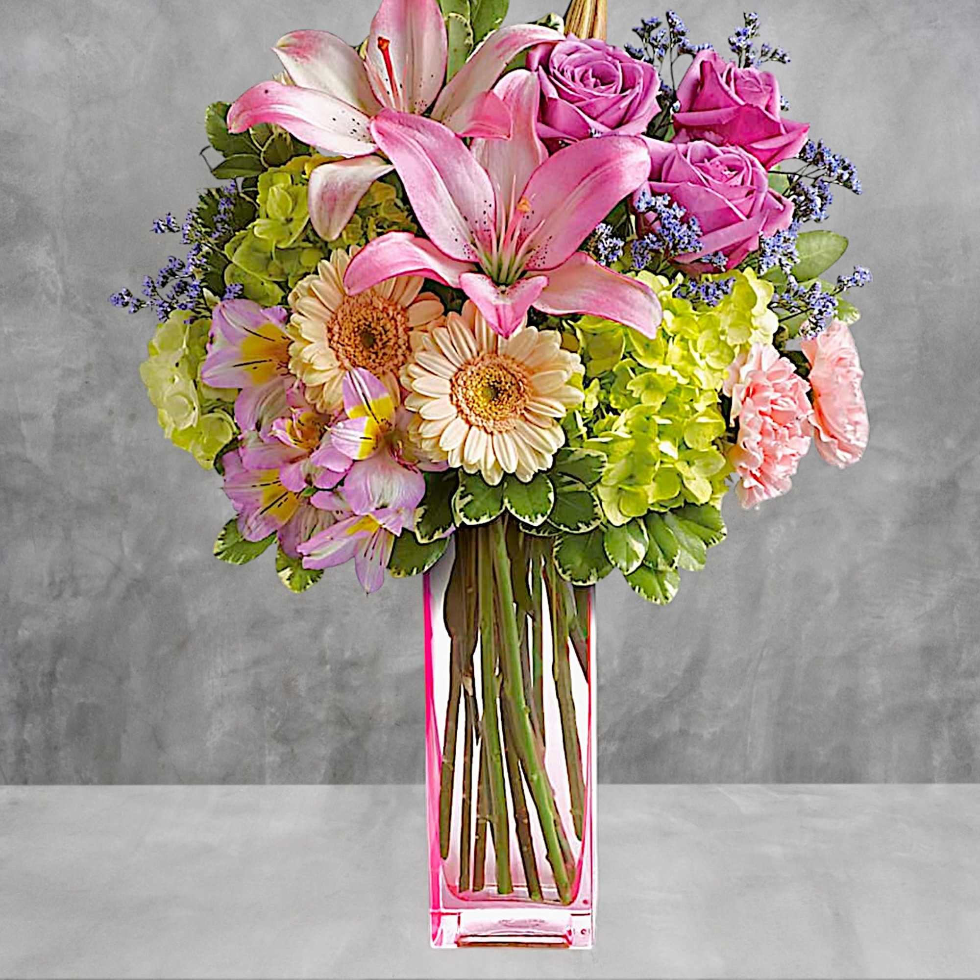 A lovely surprise no matter the occasion, this gorgeous blend of hydrangea