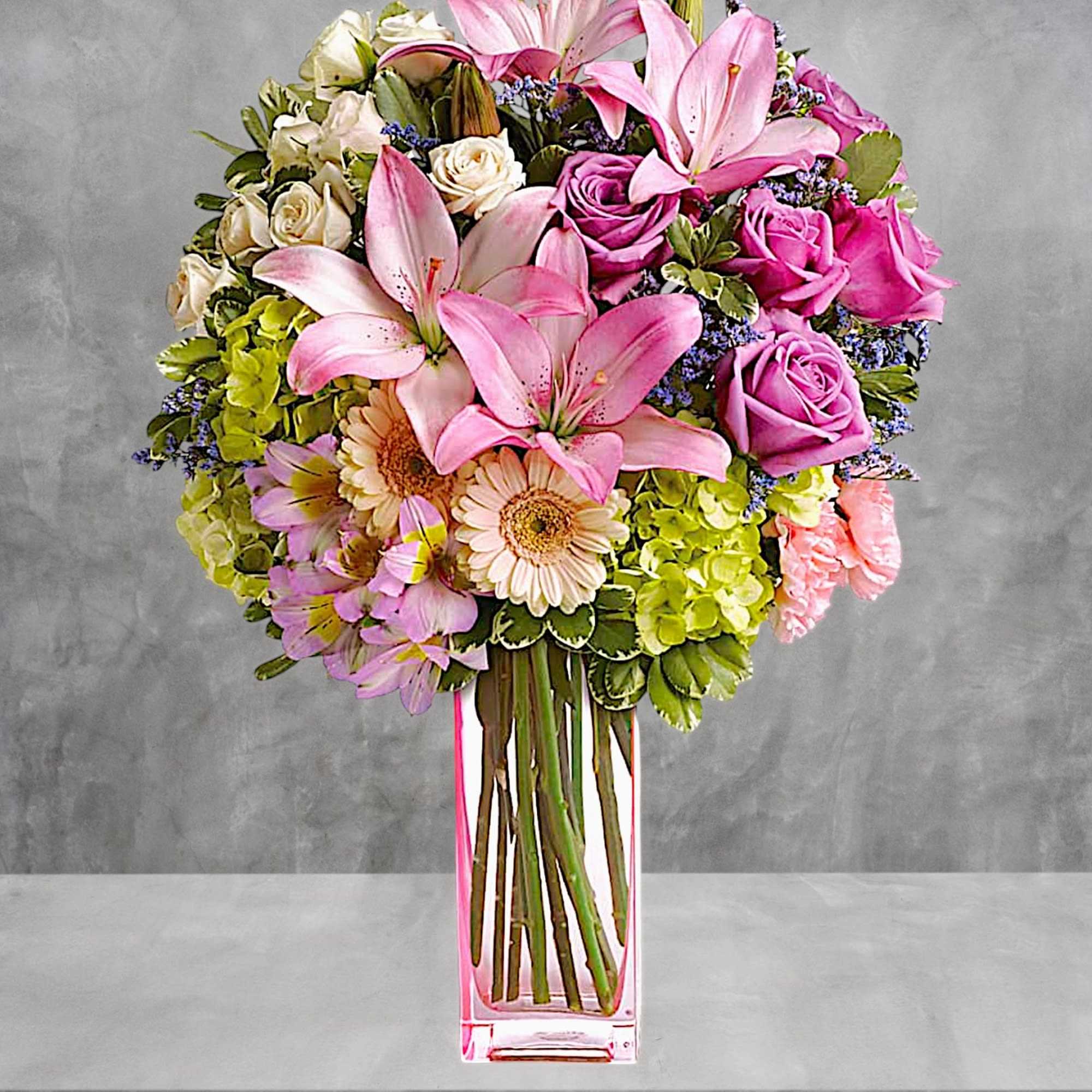 A lovely surprise no matter the occasion, this gorgeous blend of hydrangea