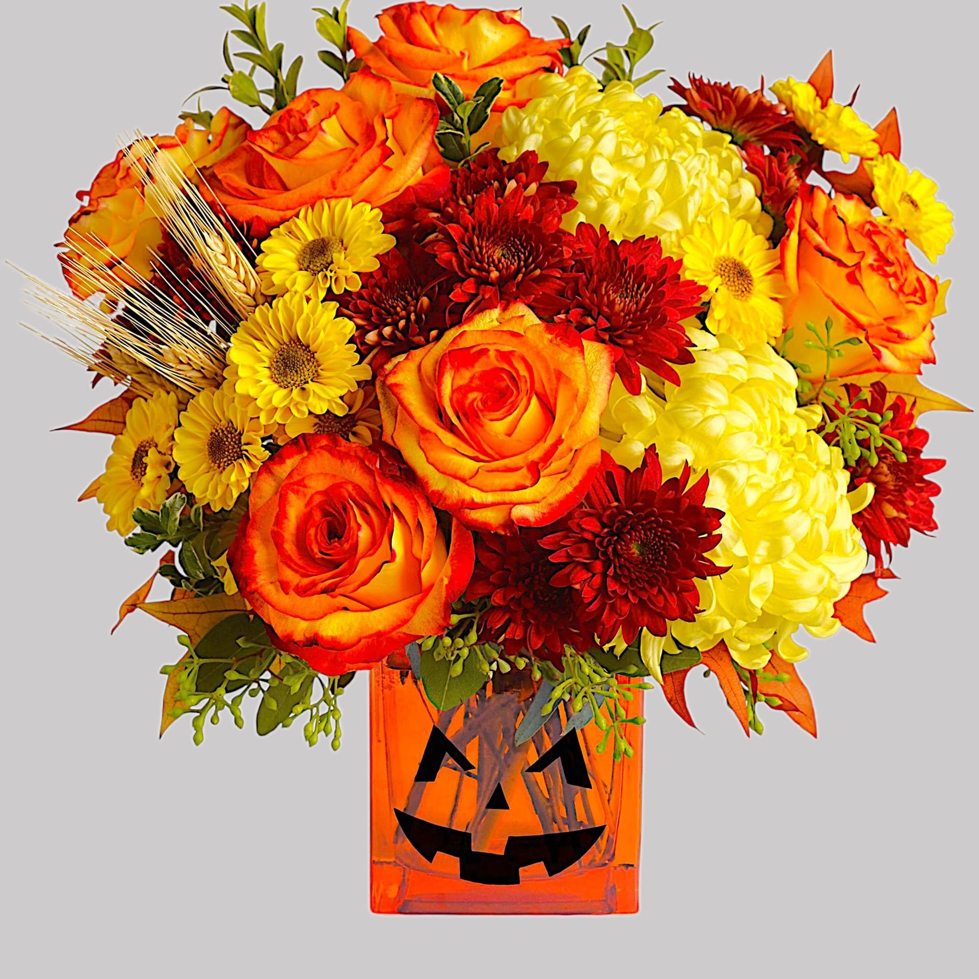Happy Yellow-een! Yellow chrysanthemums are accented with bright orange roses -all finished