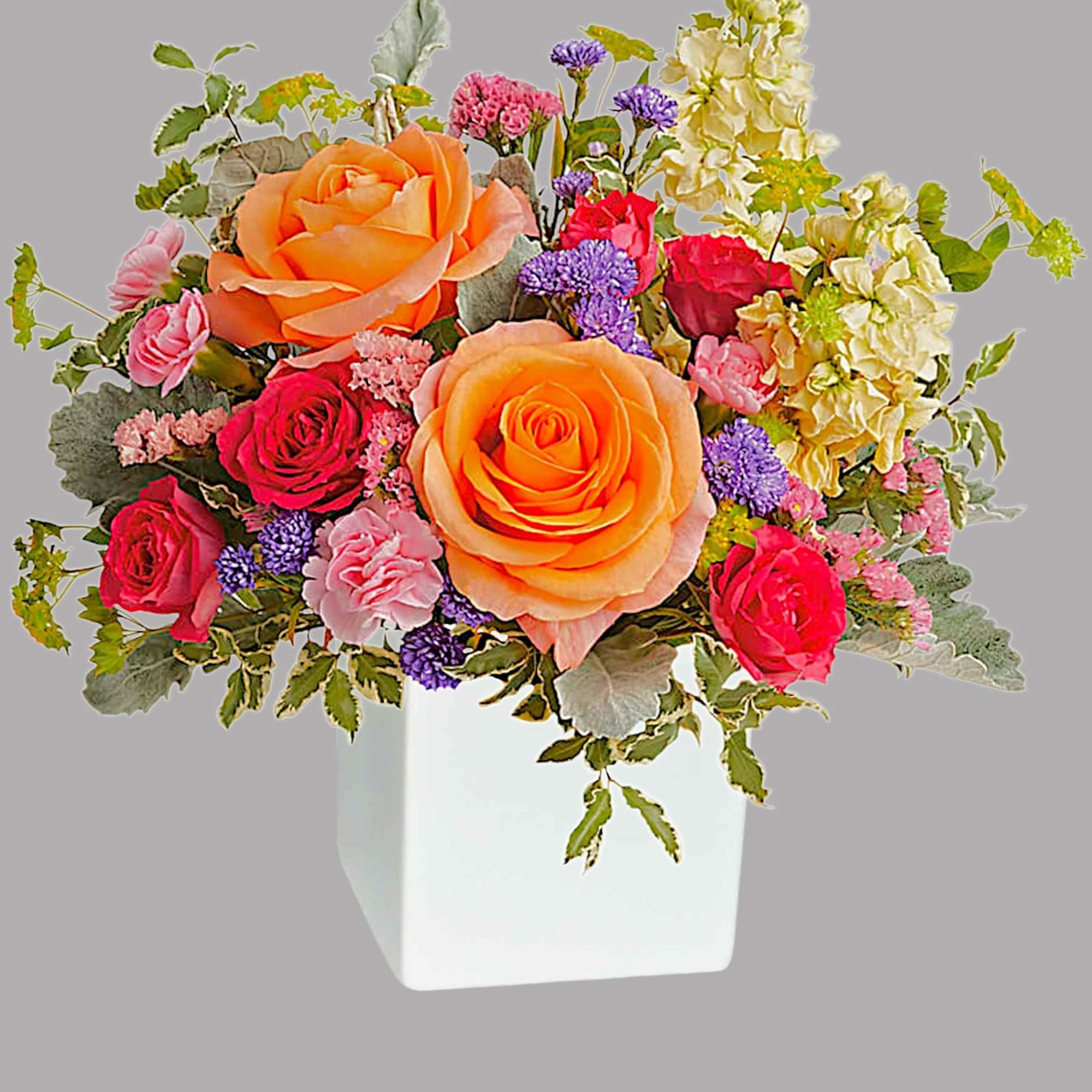 Pour on the sunshine! Filled with radiant roses, this cheerful bright arrangement