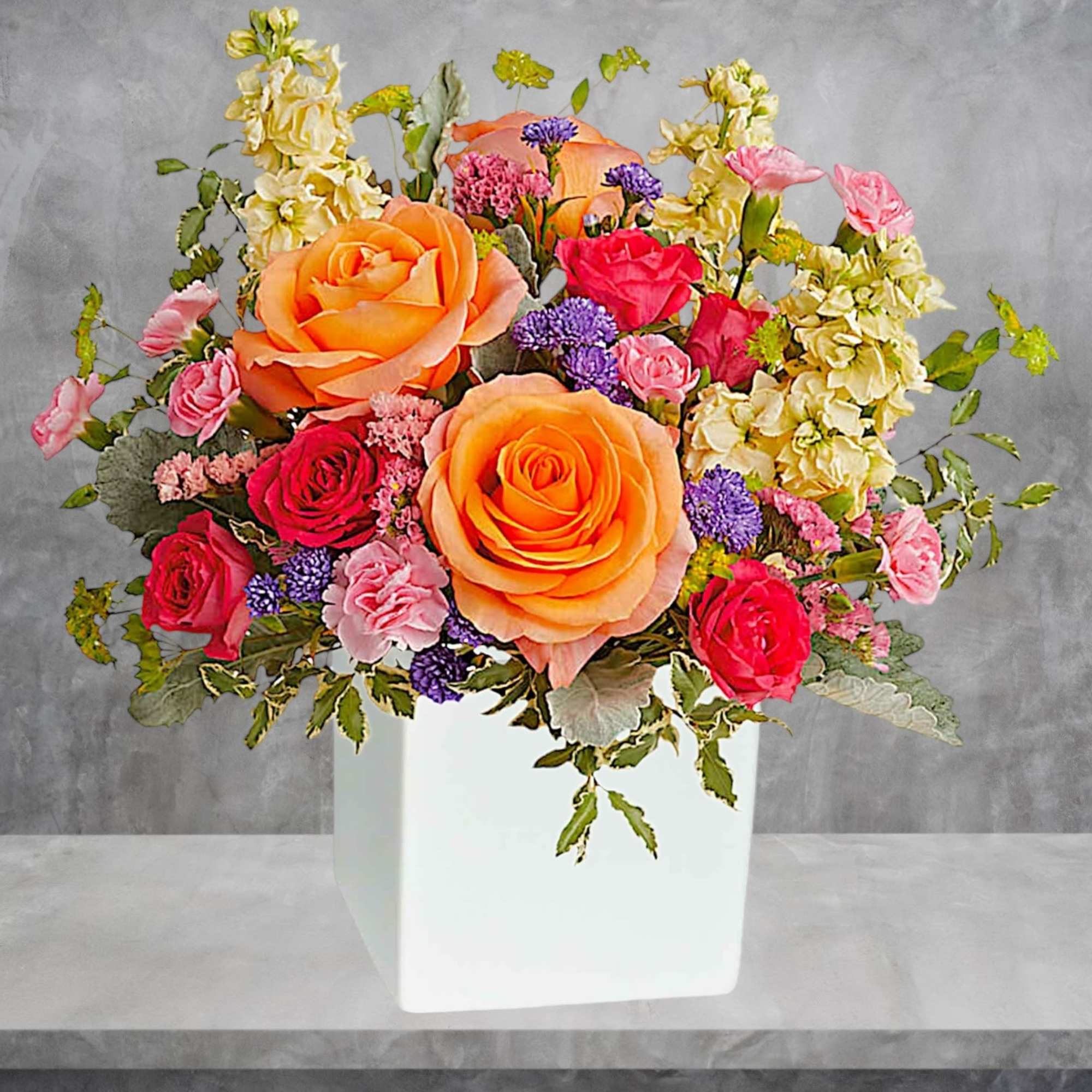 Pour on the sunshine! Filled with radiant roses, this cheerful bright arrangement