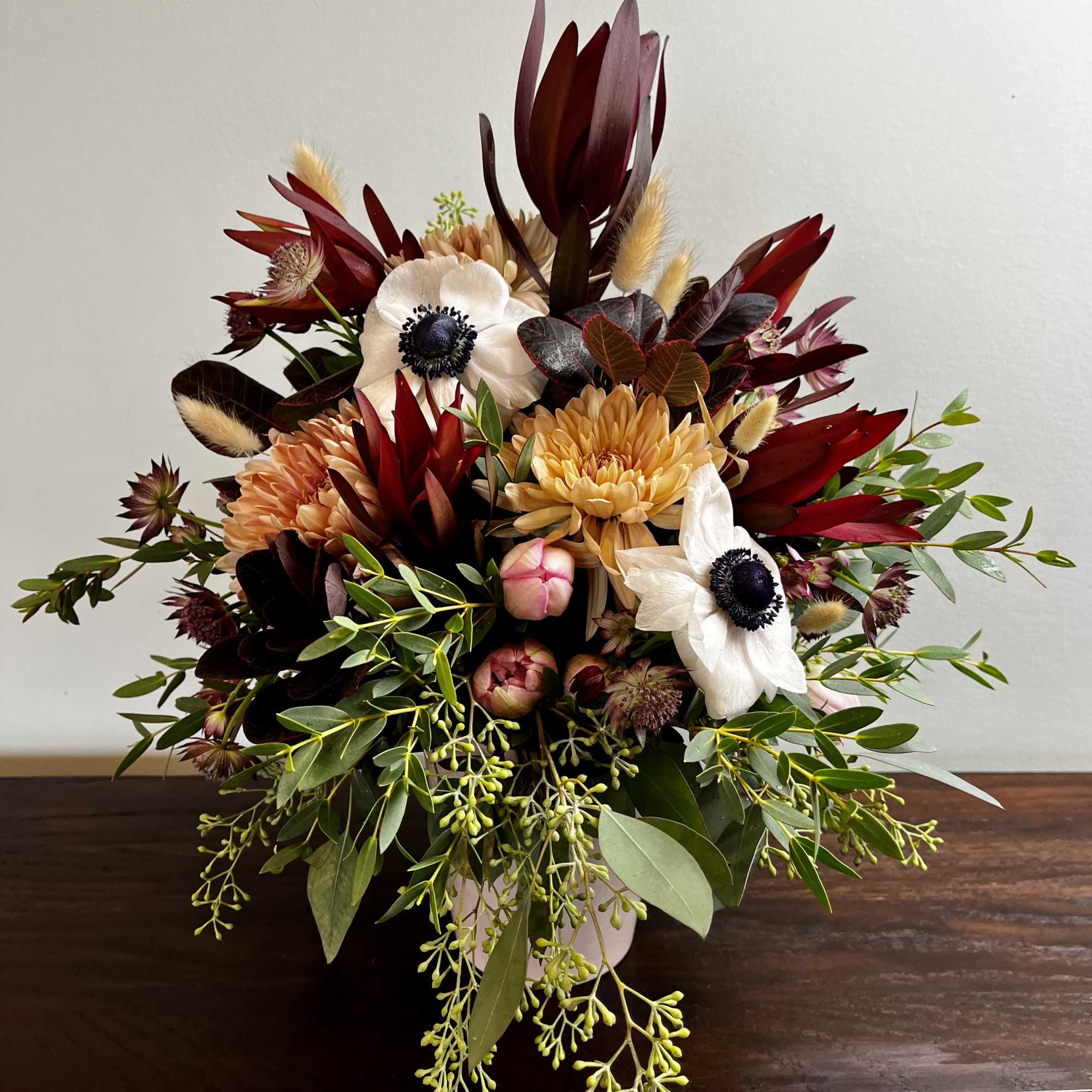 A rich display of colors and textures.  Including Anemones, Ruby Leucadendrons