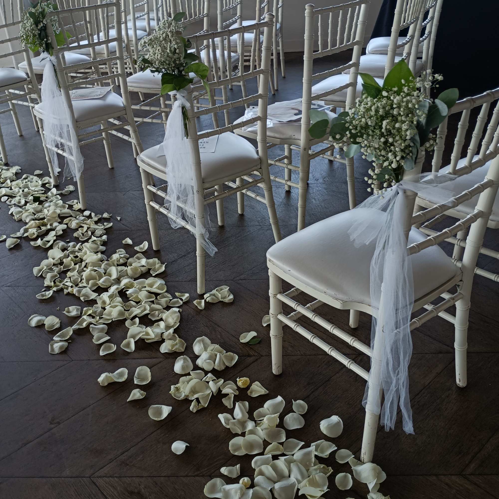 Popular, inexpensive perfect wedding touch to a pew decor: baby&#039;s beath bouquets