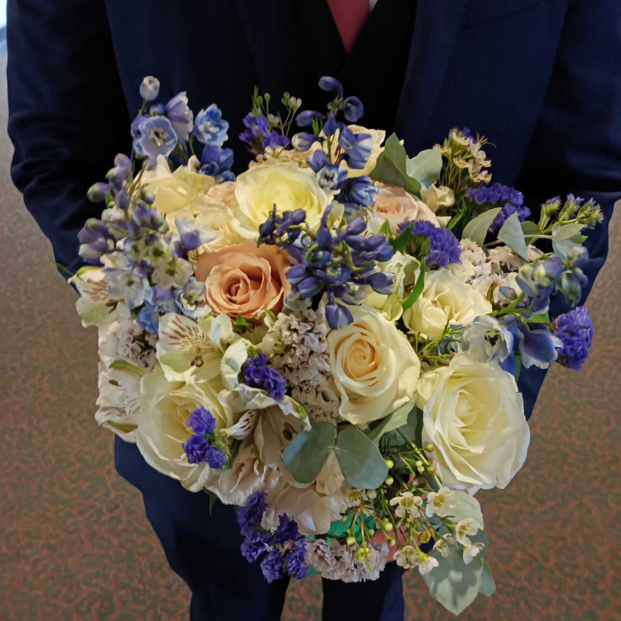 Beautiful genuine mix of light blue delphinium, white and toffee roses, dieses