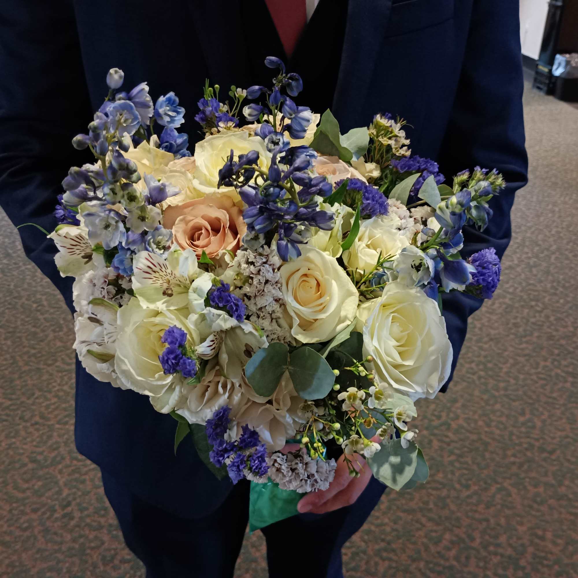 Beautiful genuine mix of light blue delphinium, white and toffee roses, dieses