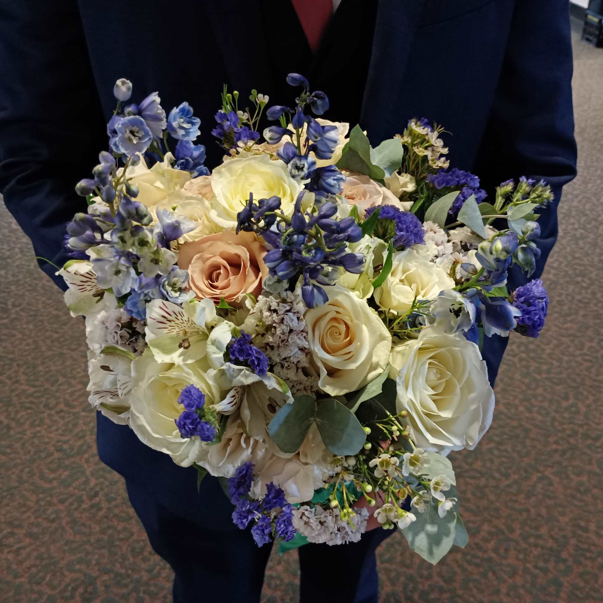 Beautiful genuine mix of light blue delphinium, white and toffee roses, dieses
