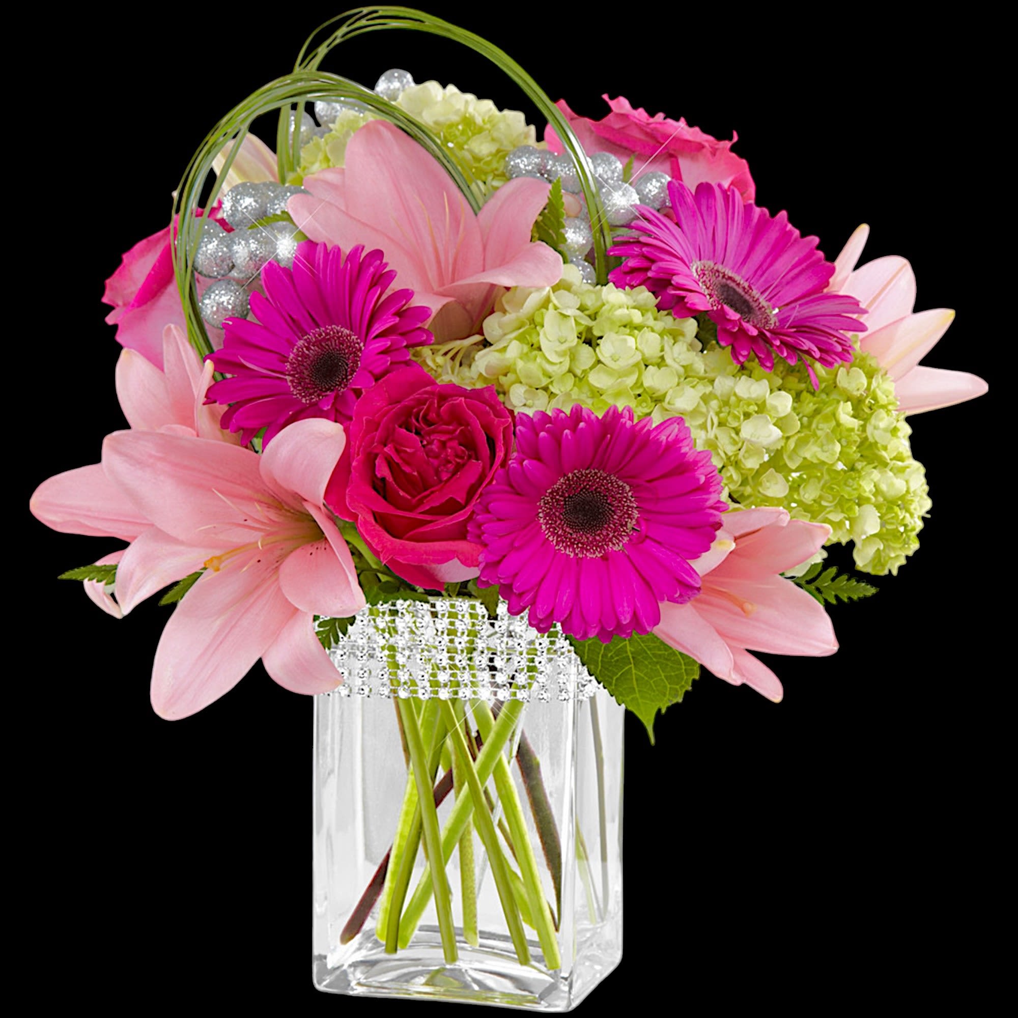 The Blooming Bliss arrangement showcases blushing blooms and definitive style to send