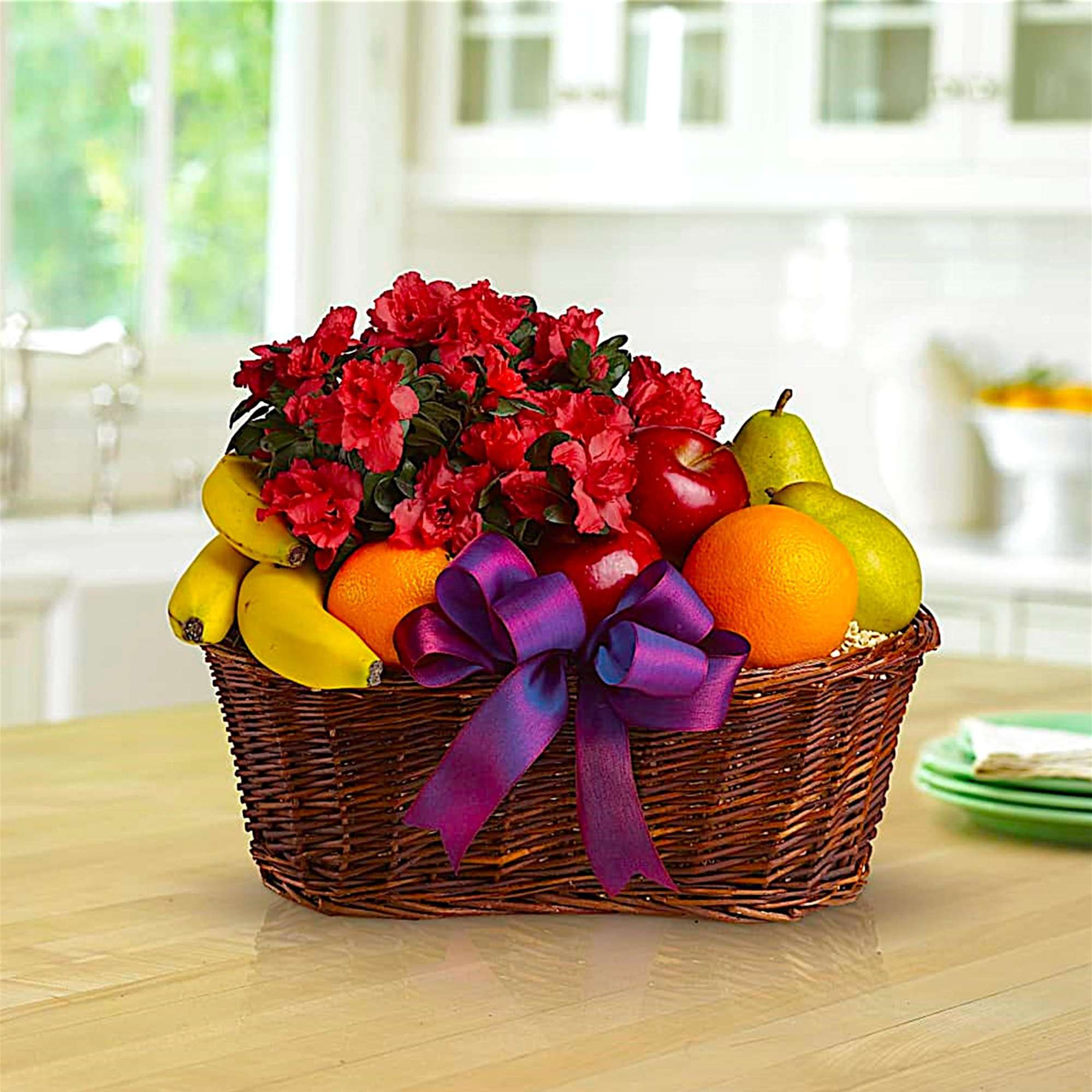 Fruit meets flowers in this delicious arrangement! Brightened by a potted azalea