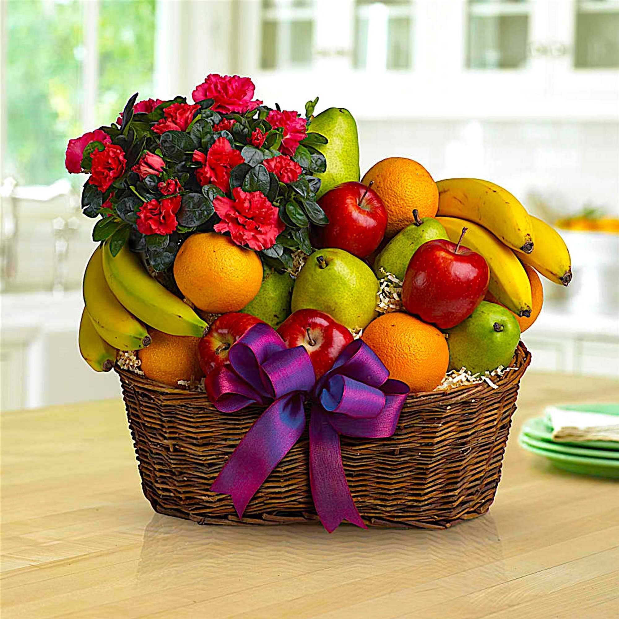 Fruit meets flowers in this delicious arrangement! Brightened by a potted azalea