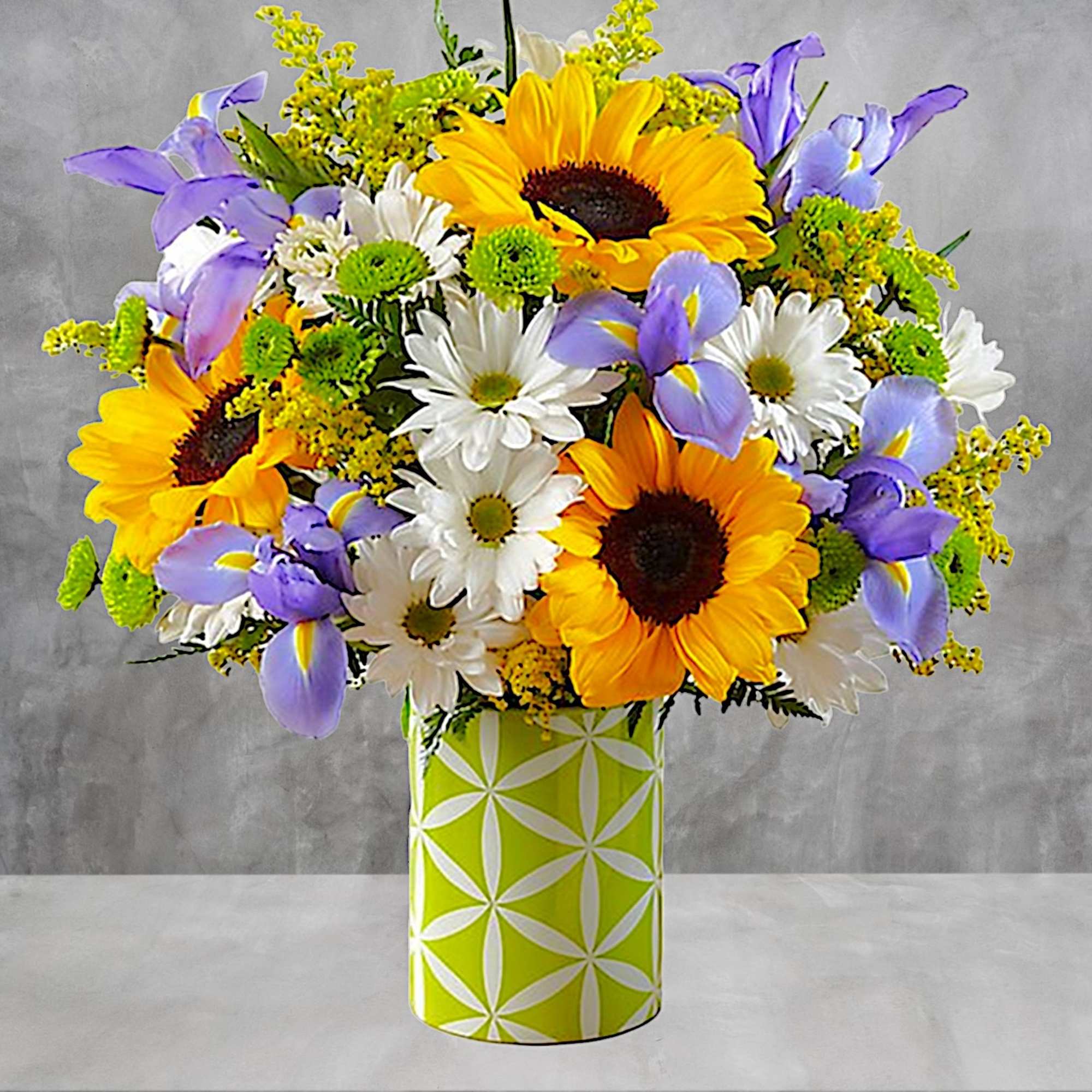 Bright yellow sunflowers, blue iris, white daisies, combined with yellow solidago, green