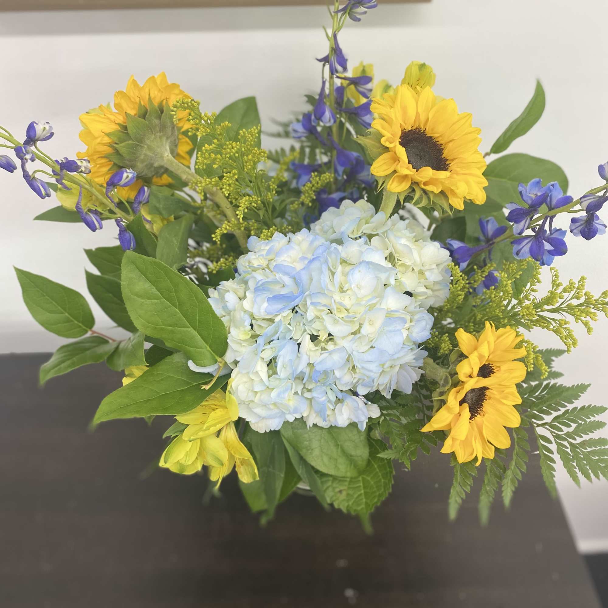 Welcome home a sweet baby boy with this bright and sunny arrangement.