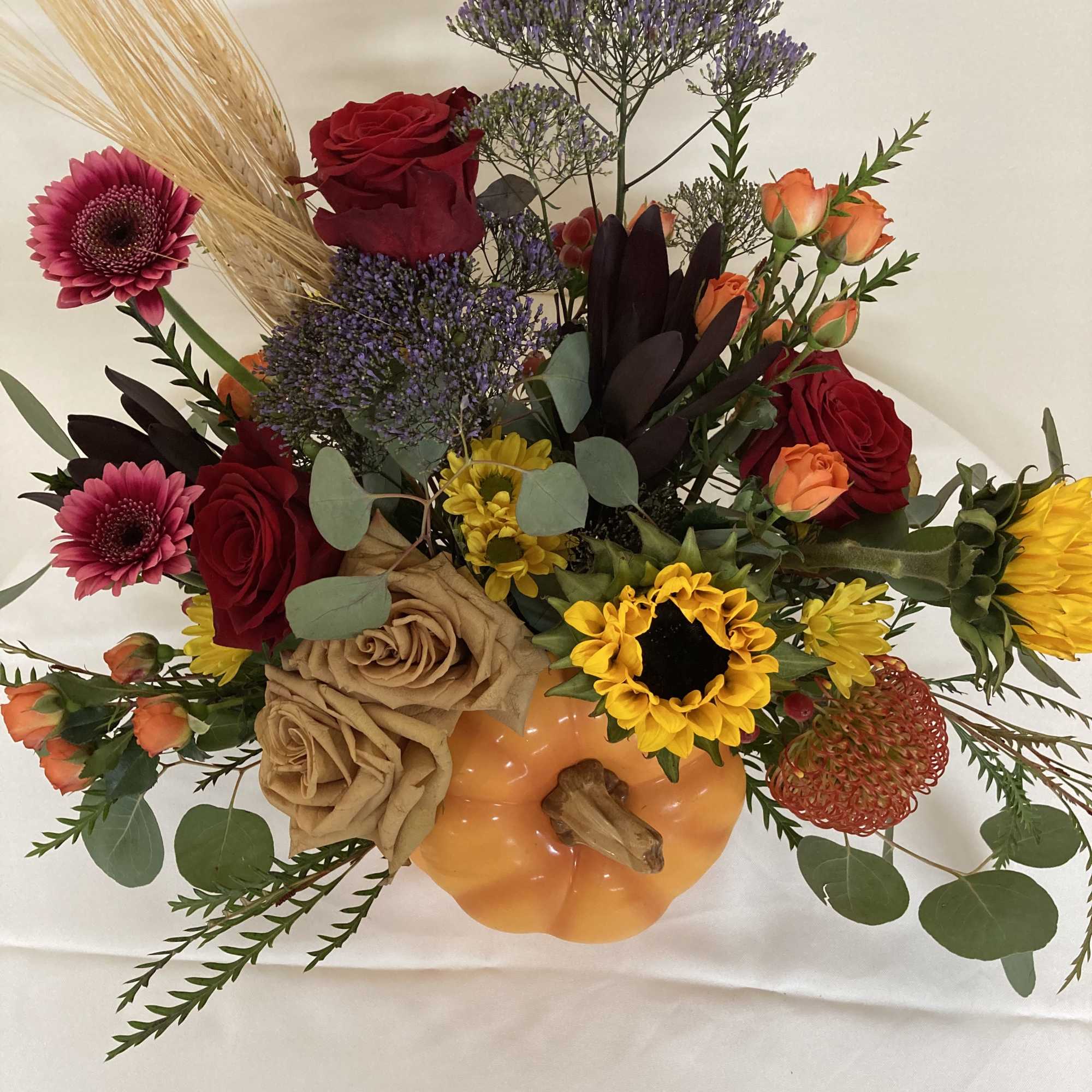 Ceramic pumpkin with a flower patch of roses, spray roses, sunflowers, Gerbera