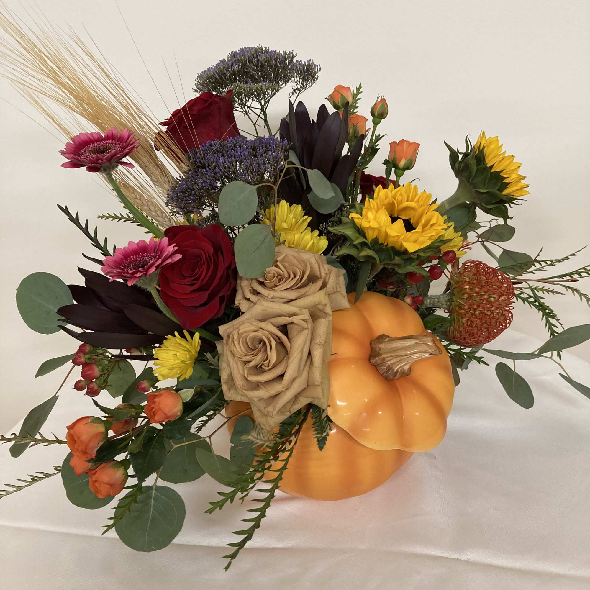 Ceramic pumpkin with a flower patch of roses, spray roses, sunflowers, Gerbera