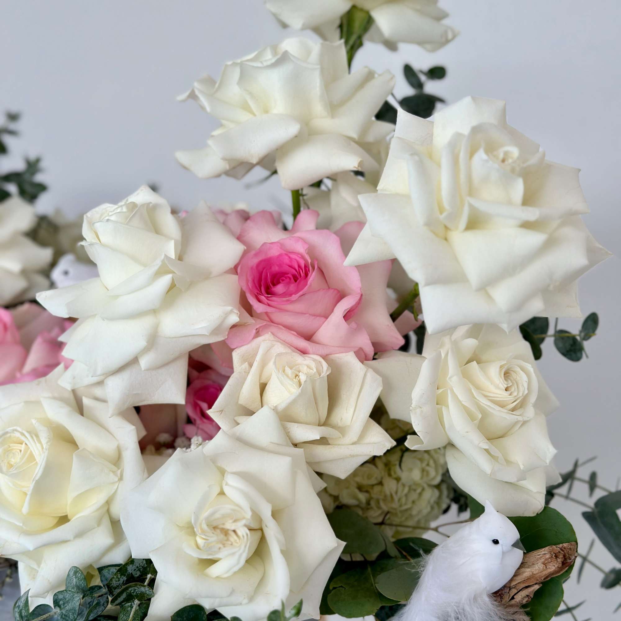 Transport yourself to a serene oasis with this arrangement, adorned with delicate