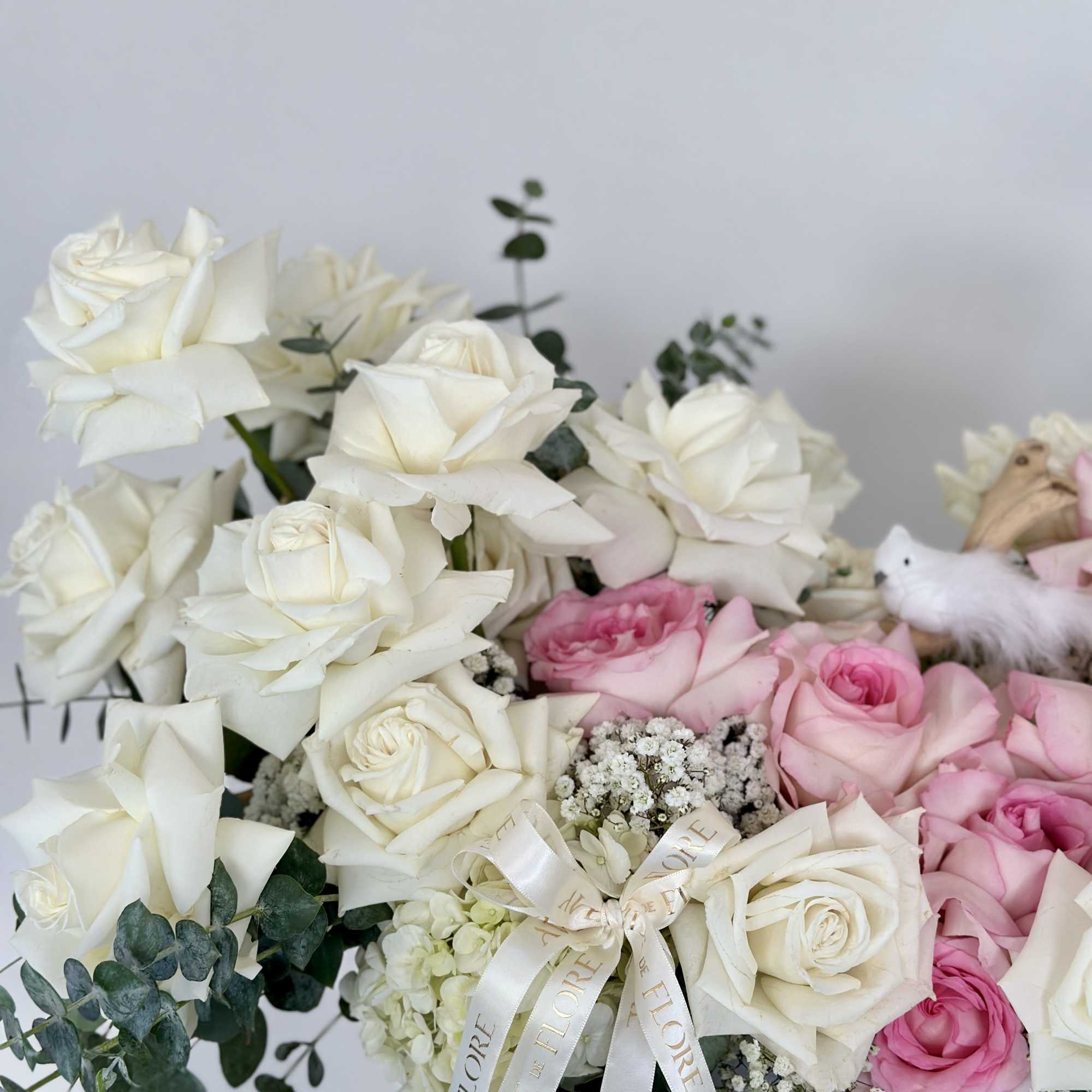 Transport yourself to a serene oasis with this arrangement, adorned with delicate