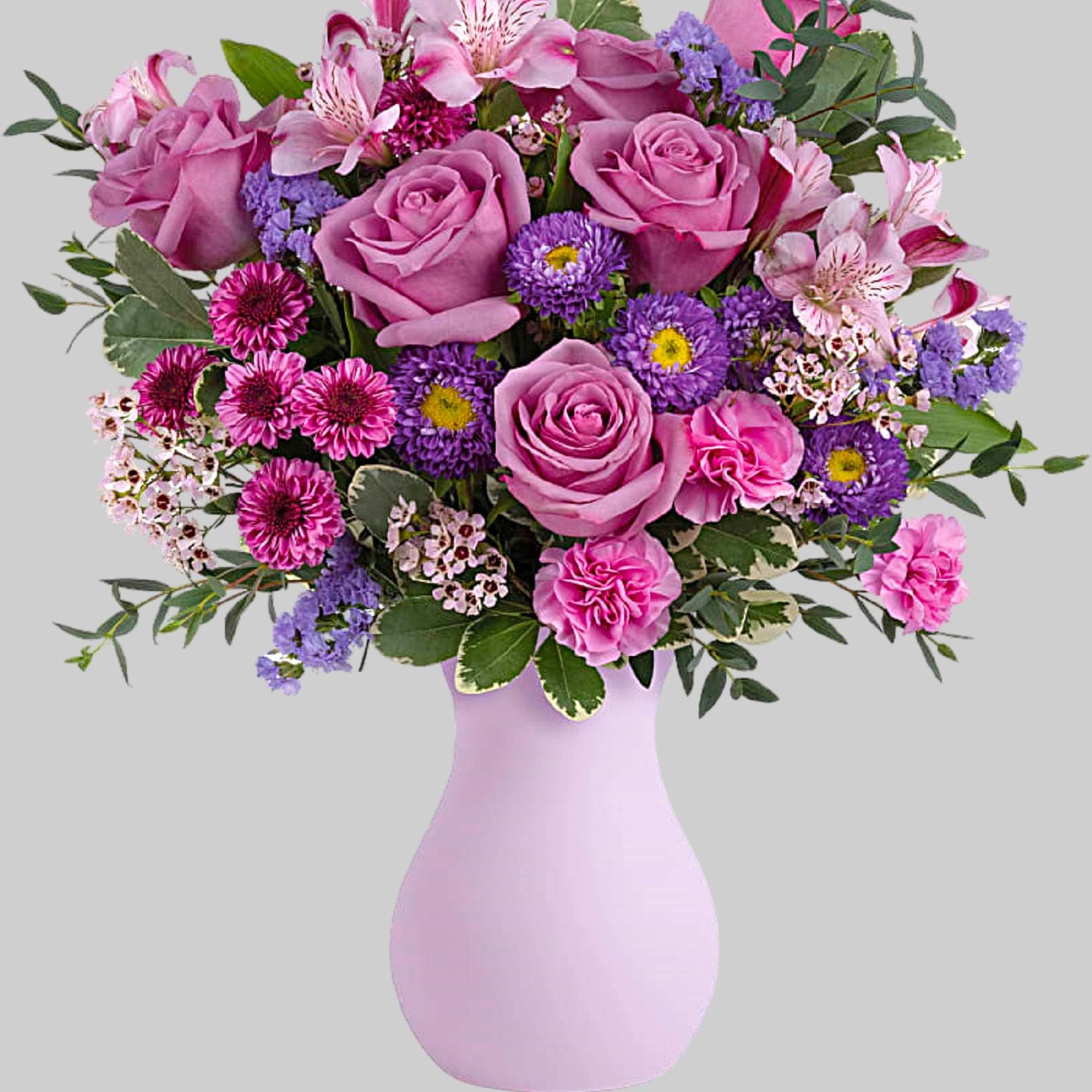 Pretty as a picture, this perfect purple arrangement spoils your someone special