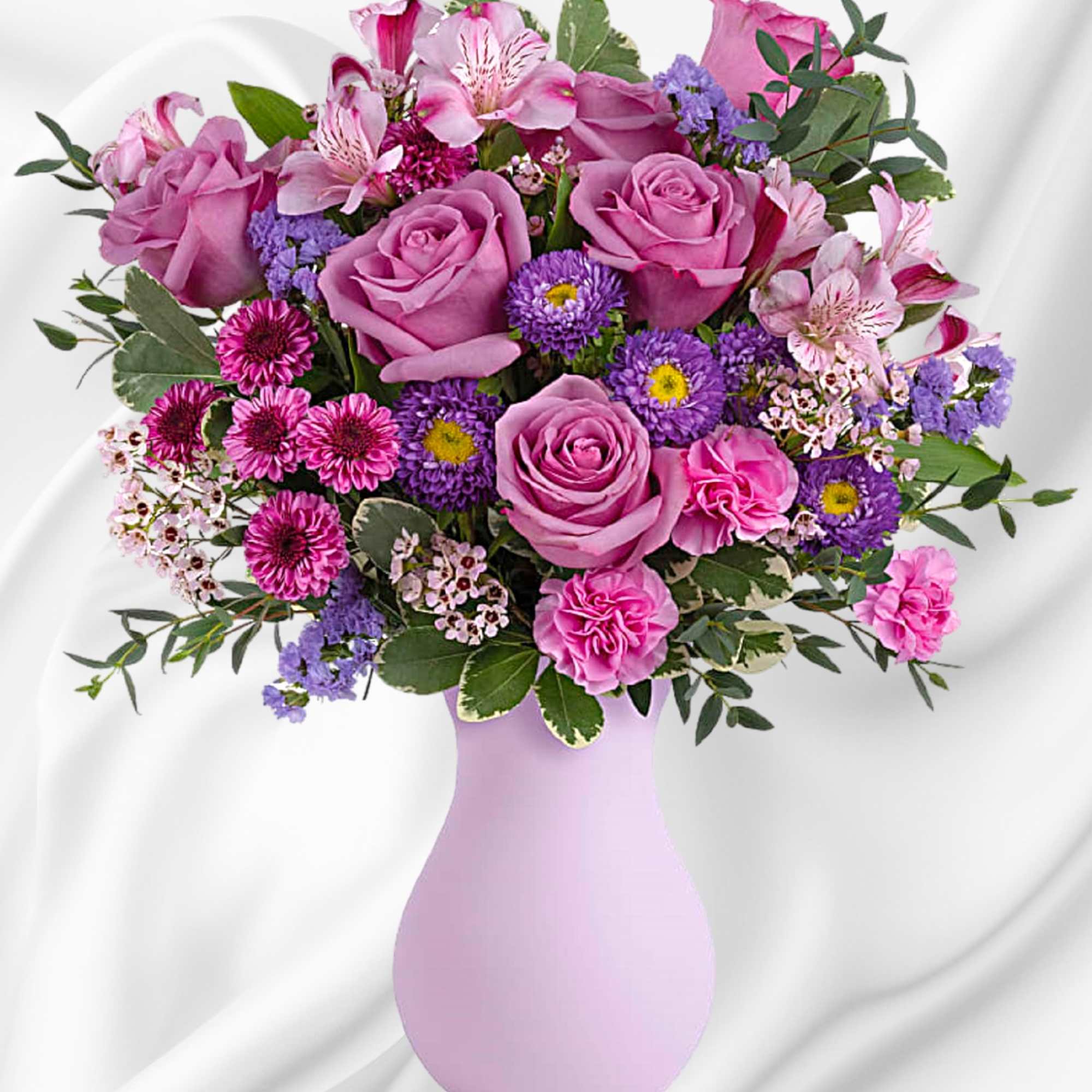 Pretty as a picture, this perfect purple arrangement spoils your someone special