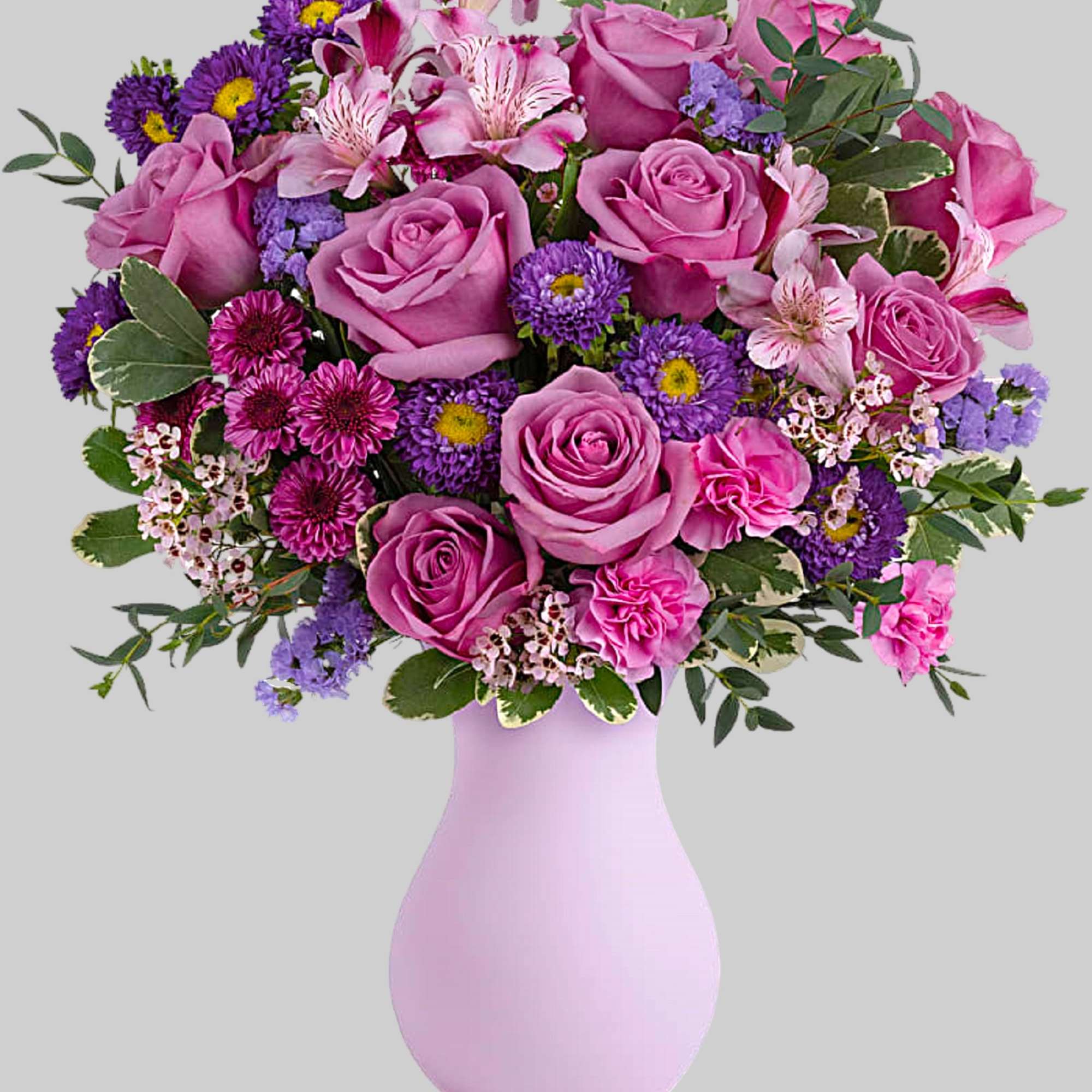 Pretty as a picture, this perfect purple arrangement spoils your someone special