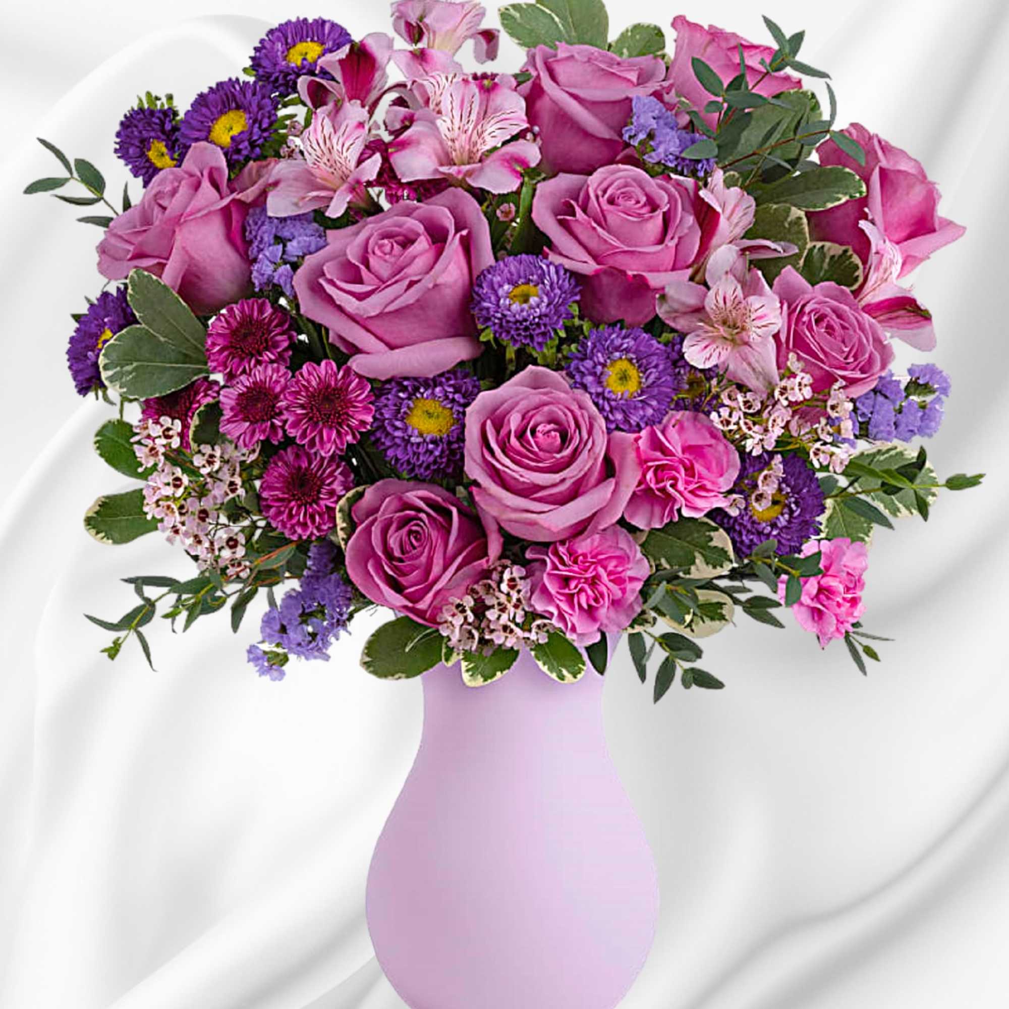 Pretty as a picture, this perfect purple arrangement spoils your someone special