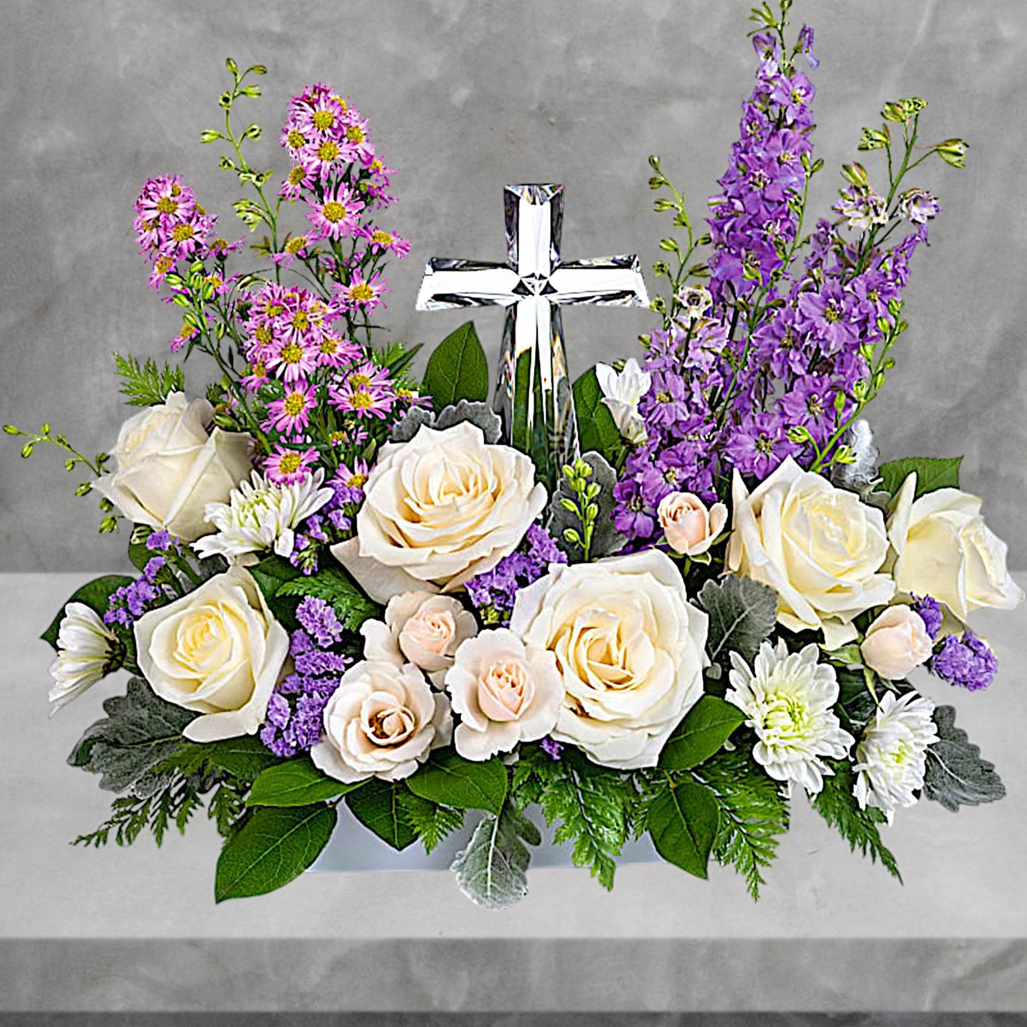 Soft and serene, this artistic array of cream and lavender blooms around