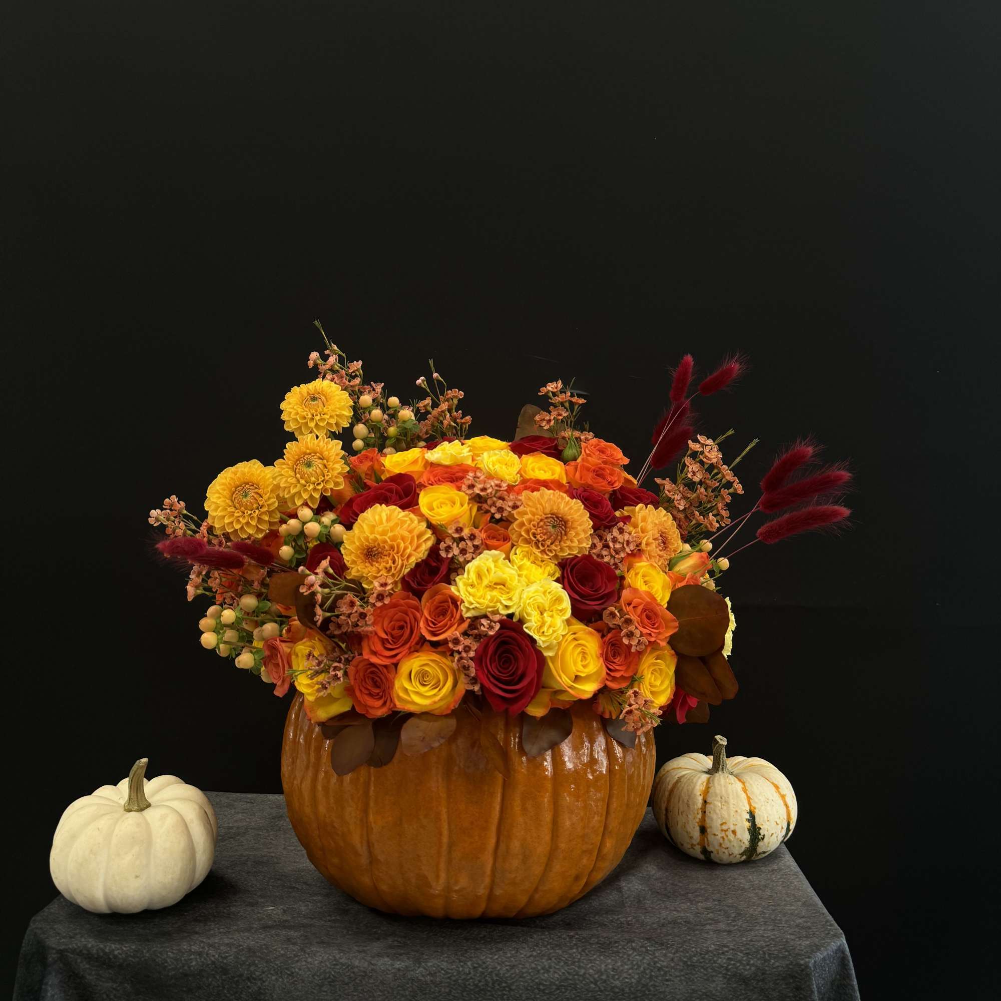 Beautiful autumn inspired arrangement in pumpkin 