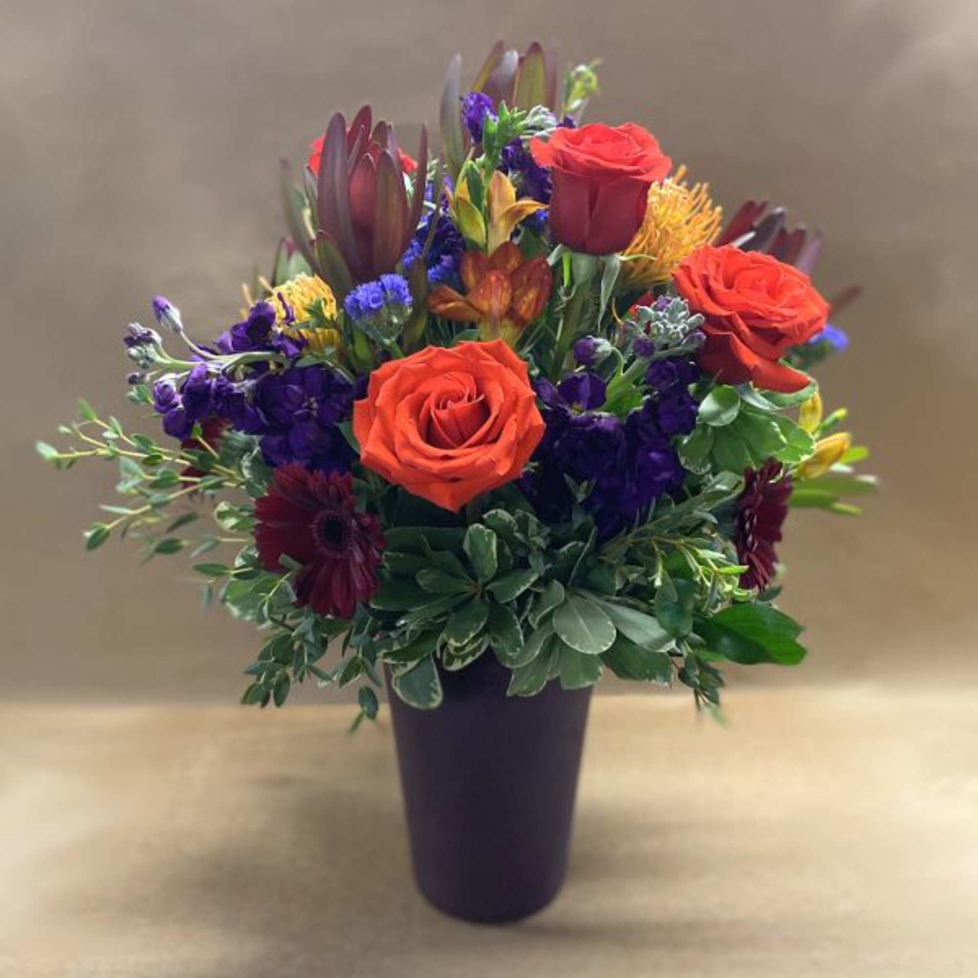 Rich and vibrant hues of orange, burgundy, deep red, purple and golden