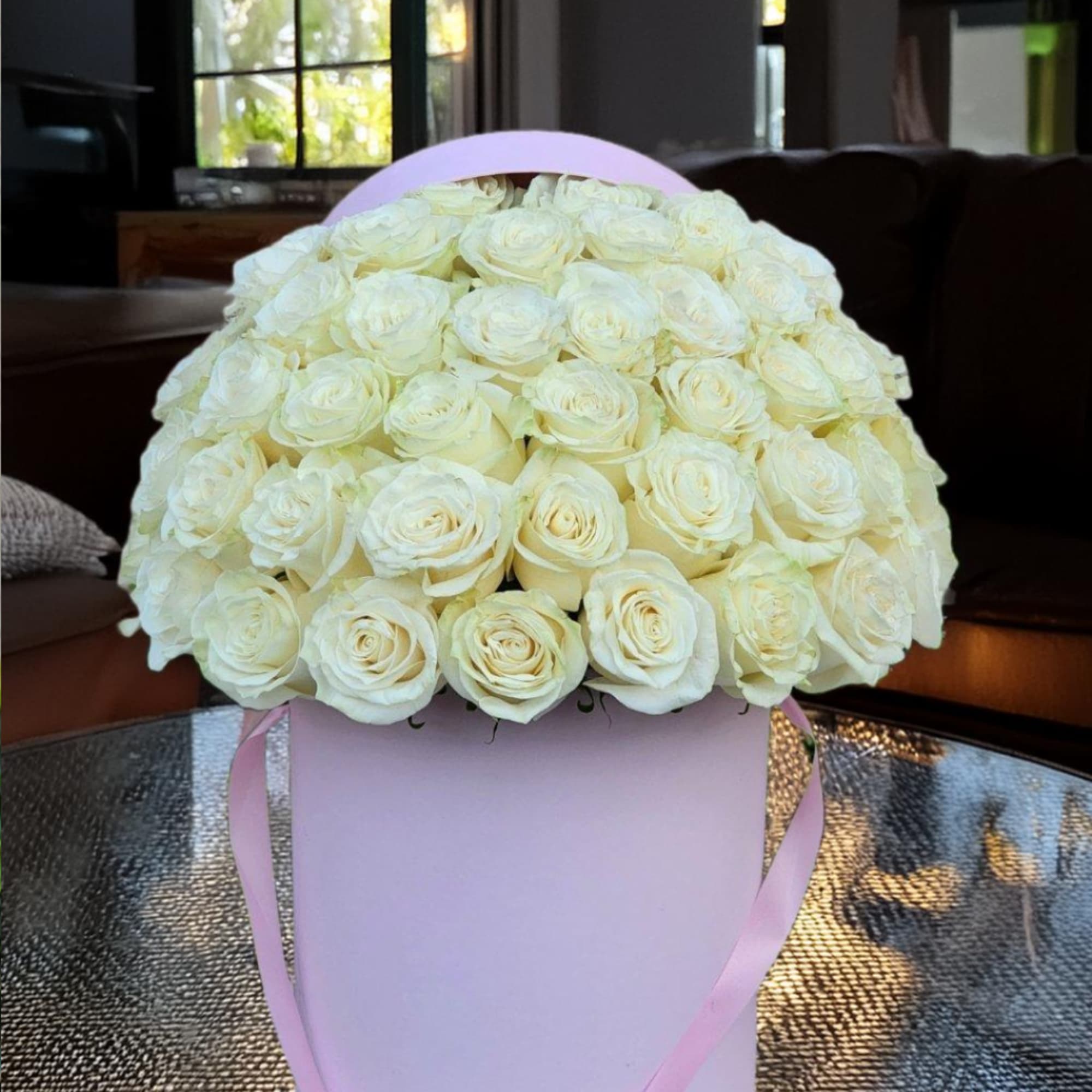 Indulge in luxury with our exquisite white roses elegantly presented in a