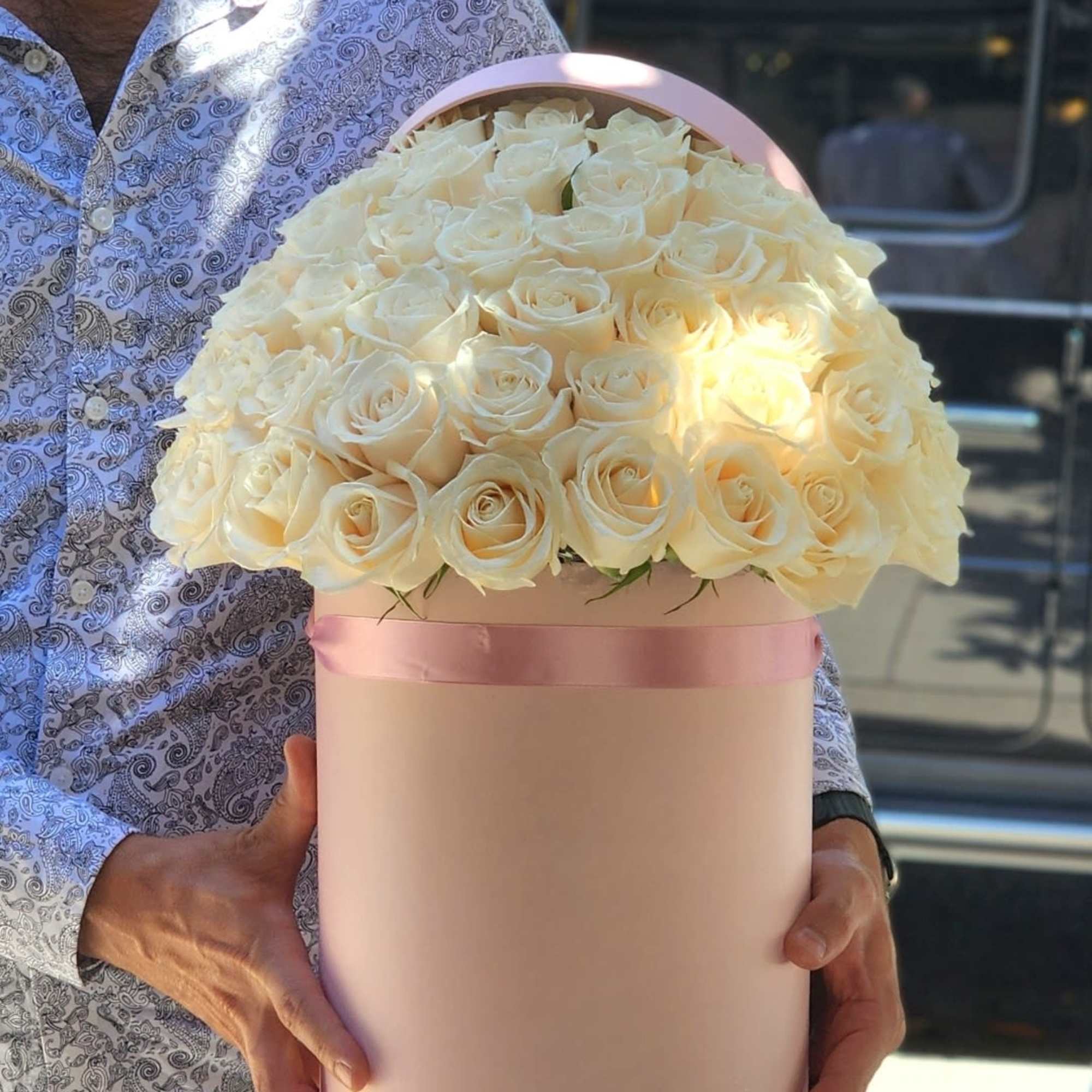 Indulge in luxury with our exquisite white roses elegantly presented in a