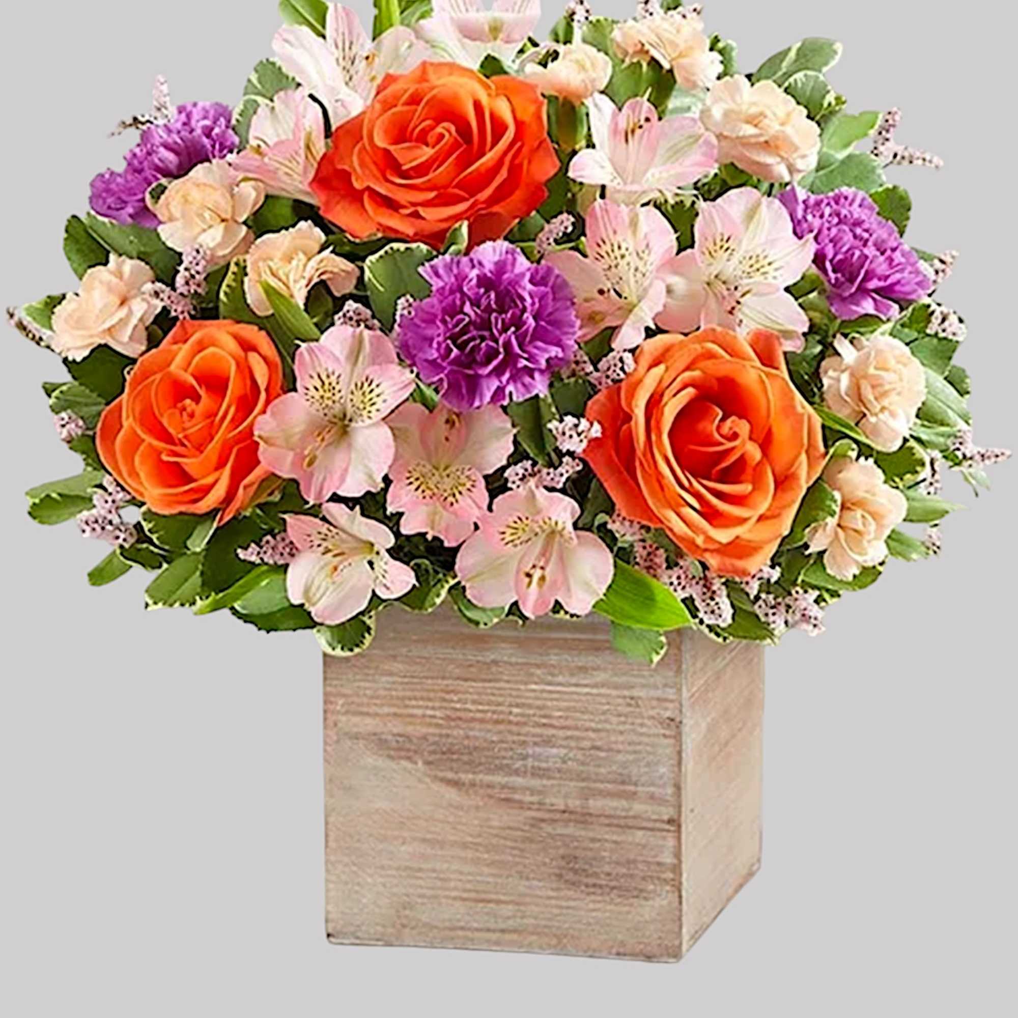 Chic meets sweet. This beautiful arrangement flaunts fresh spring style, gathered with