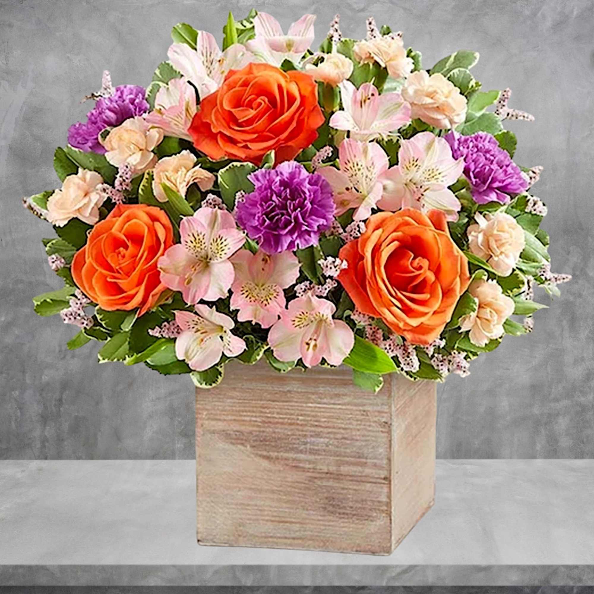 Chic meets sweet. This beautiful arrangement flaunts fresh spring style, gathered with