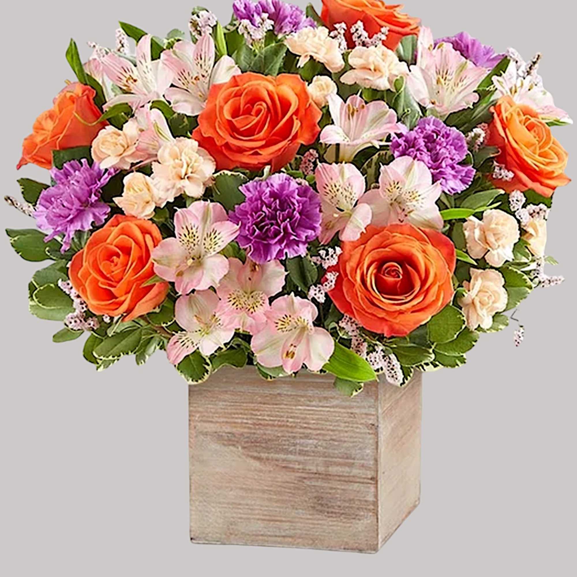 Chic meets sweet. This beautiful arrangement flaunts fresh spring style, gathered with