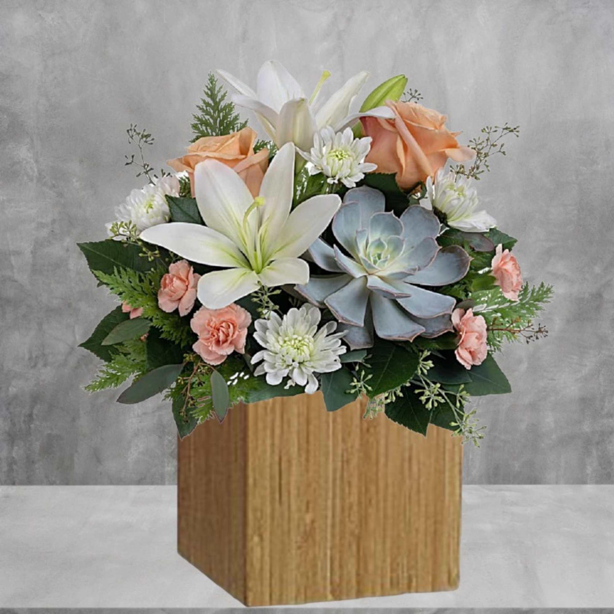 Sleek meets sweet! This modern arrangement pairs a sculptural succulent with soft