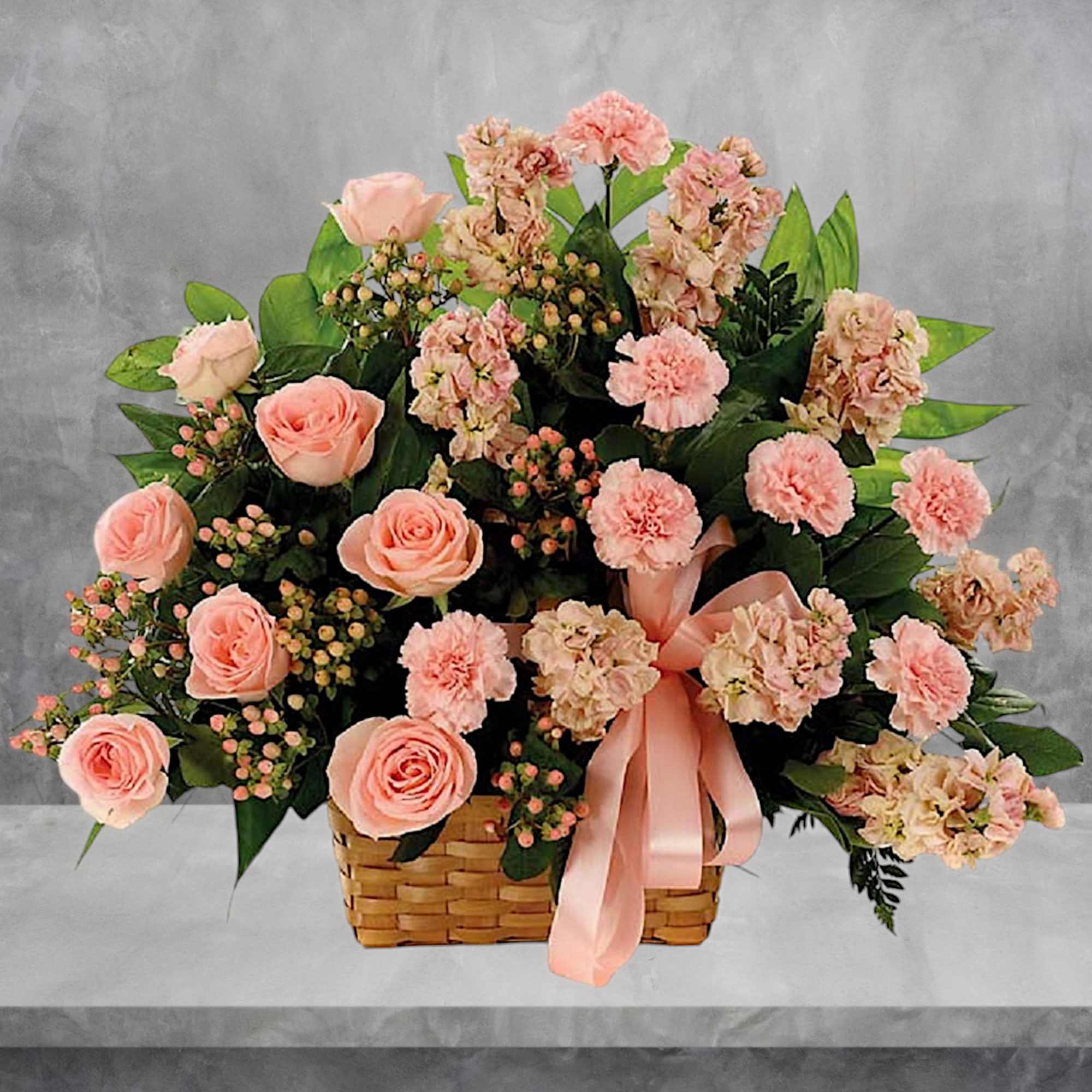 This classic peach fresh flower basket arrangement is a lovely way to