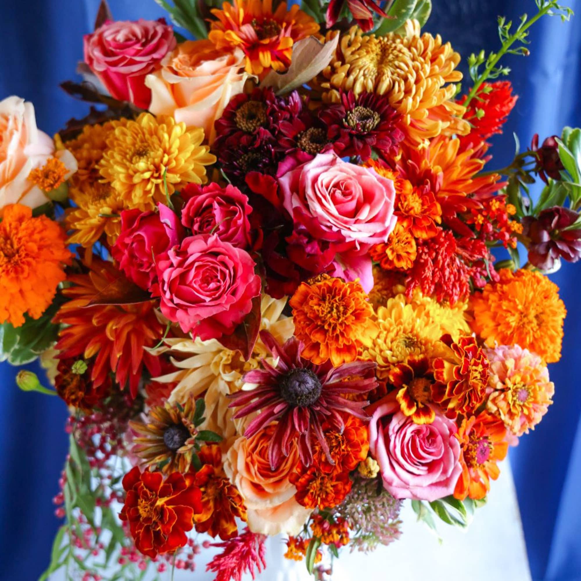 The Russet Leaves Arrangement is the quitessential classic autumn arrangement. Bursting with