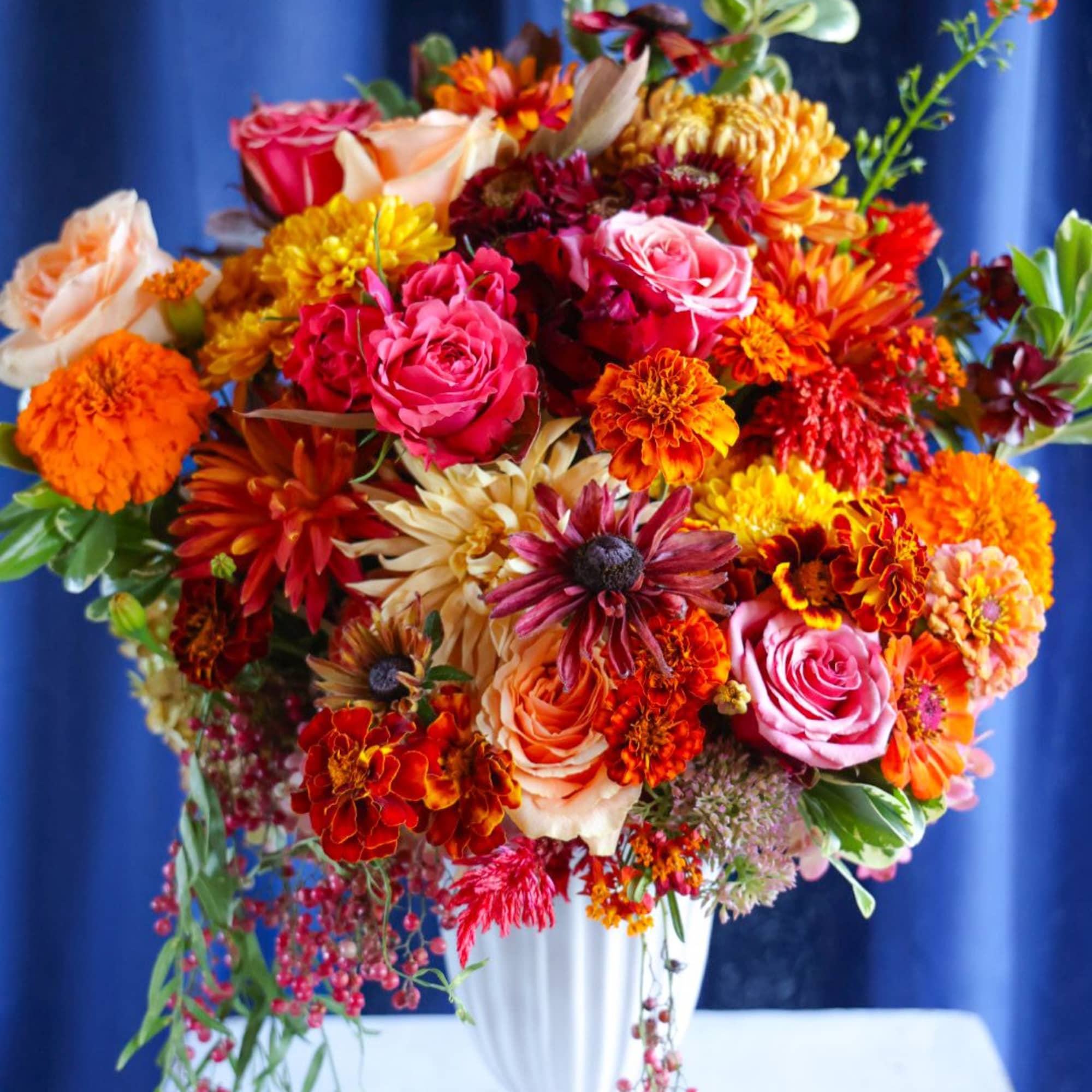 The Russet Leaves Arrangement is the quitessential classic autumn arrangement. Bursting with